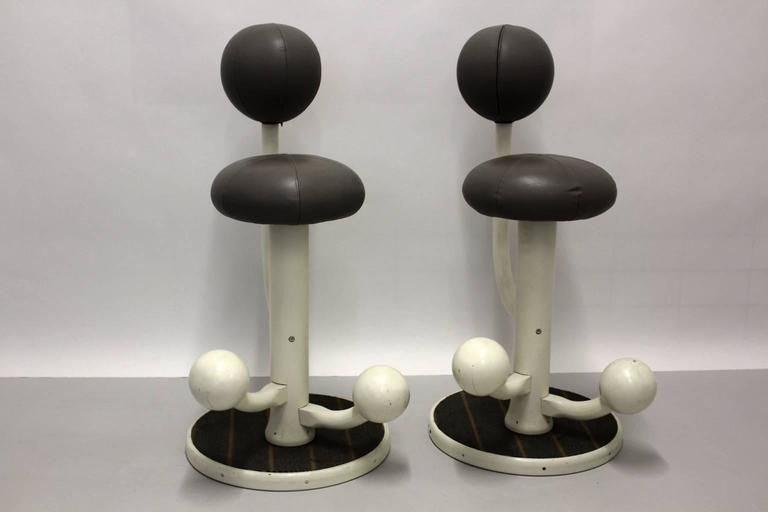 Scandinavian Modern pair of vintage bar stools, which were designed by Peter Opsvik for Stokke Norge 1985 Norway.
A fantastic pair of bar stools made of white lacquered wood and grey faux leather, while the base is covered with grey carpet with red