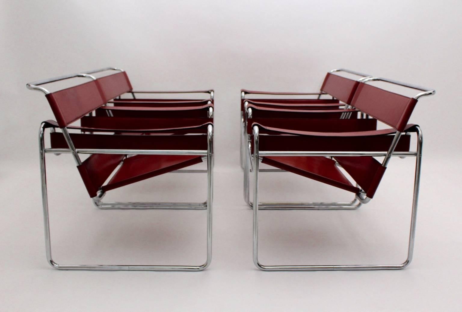 A Bauhaus Vintage set of four leather Wassily lounge chairs or amrchairs Mod B 3, which were designed by Marcel Breuer 1925-1927 and executed by Fasem ( leather stamped ) Italy, 1986.
The tabular steel frame shows red color leather seat and back