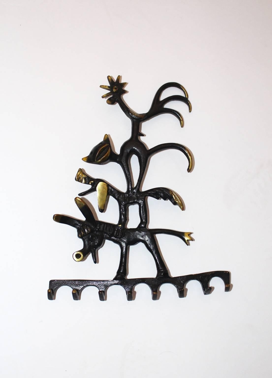 Very nice Key Hanger designed by Walter Bosse and executed by Herta Baller, Austria, 1950s. 
The motif signs the figures of the 