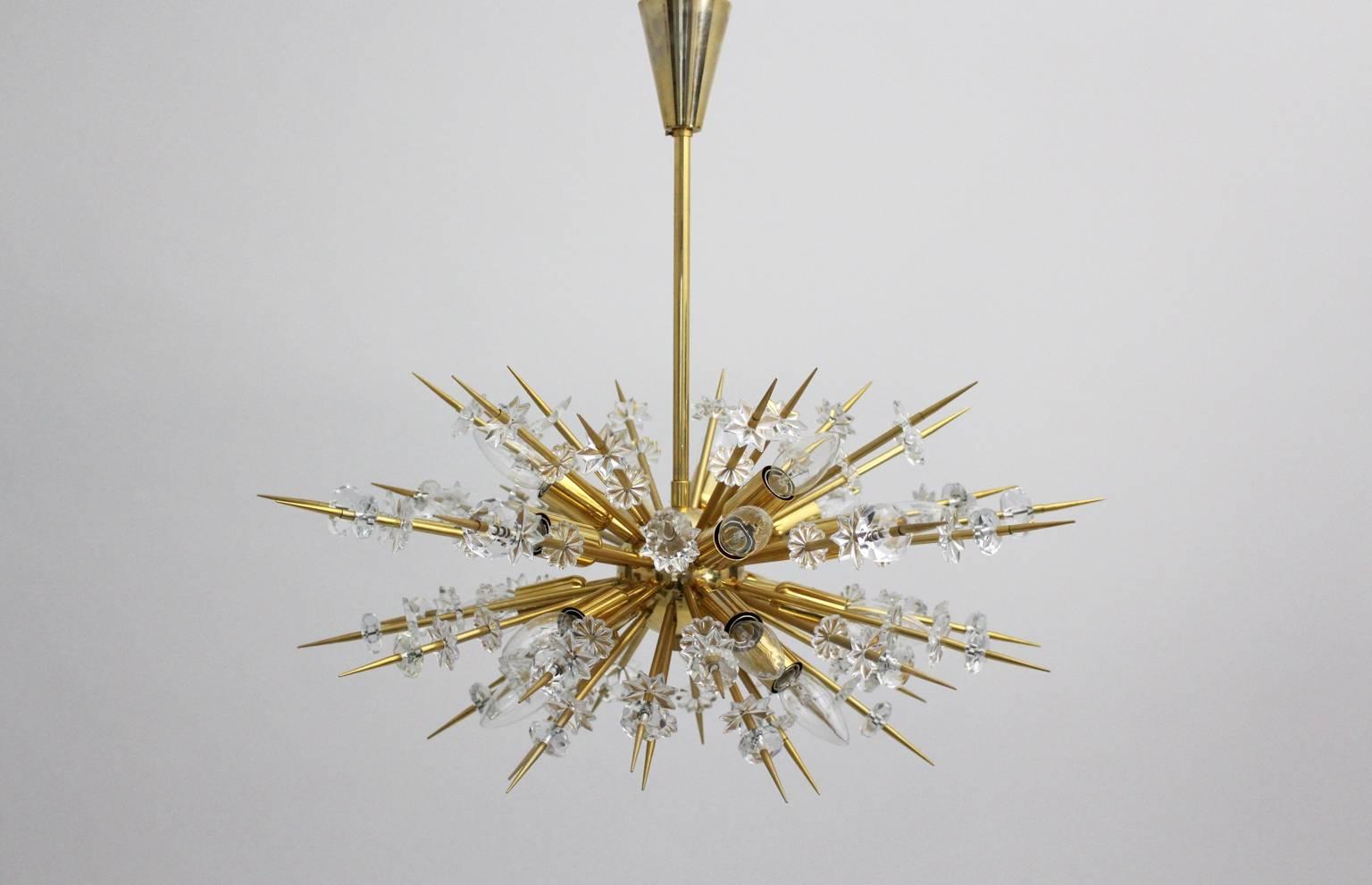 A Mid Century Modern vintage brass and glass Sputnik Chandelier or Pendant, which was designed and executed by Bakalowits & Soehne, Vienna, Austria 1972.
This early type with the data number 93456/18/65 was carefully restored and rewired,  and is