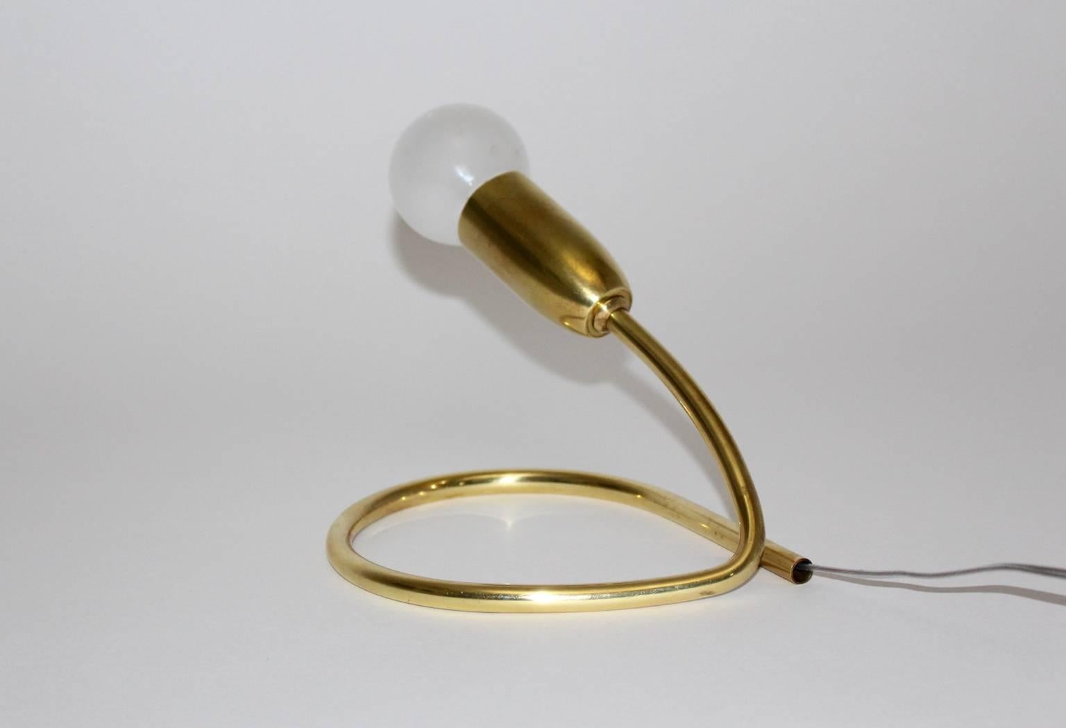 Mid Century Modern vintage table lamp made from brass by J.T. Kalmar, Vienna 1950s. 
The table lamp is ready to use it in your home.
One socket E 14.
All measures are approximate.
 