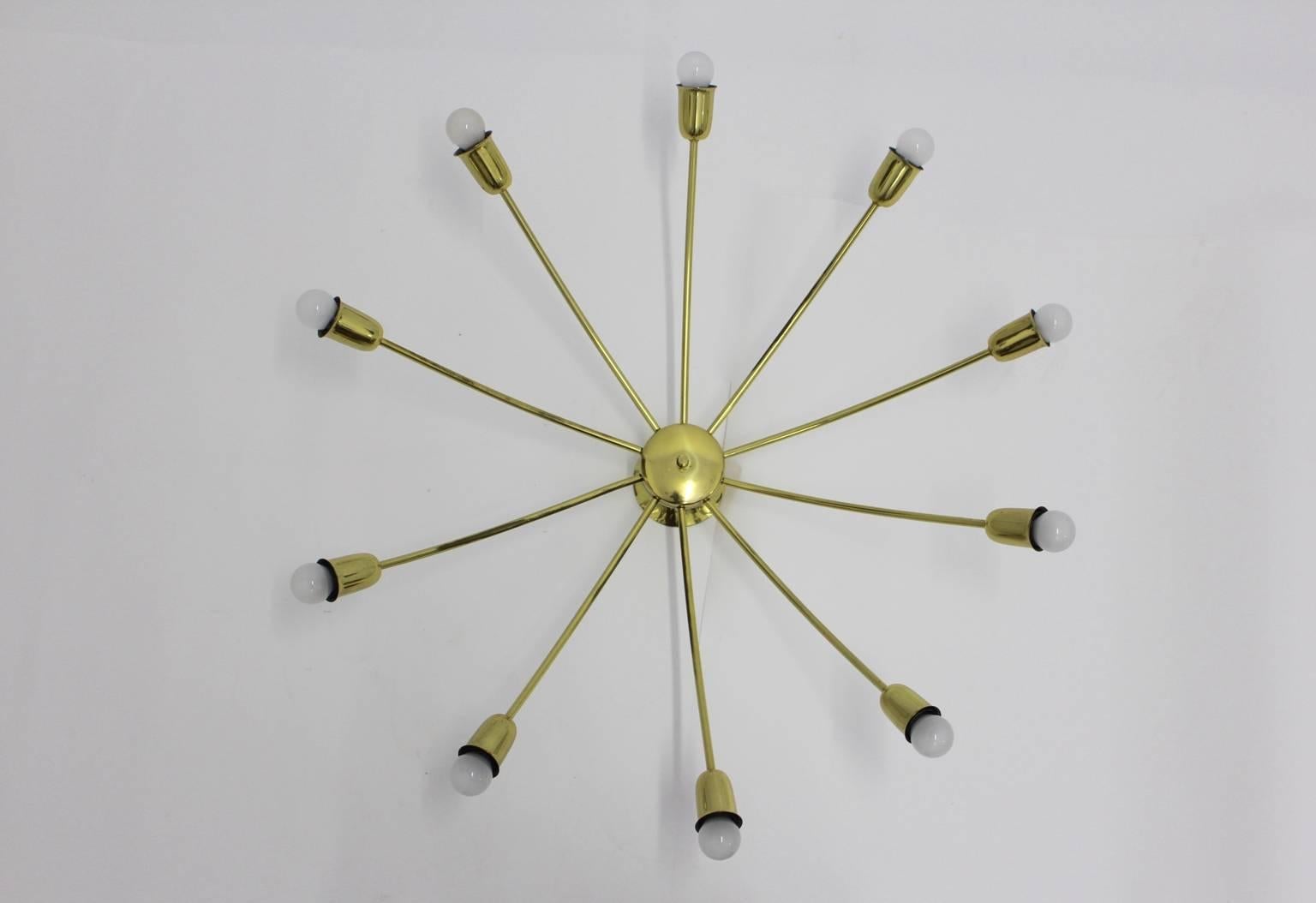 Mid Century Modern Flush Mount, which features ten curved, from up to down, brass arms with ten sockets E 14.
The ceiling lamp or flush mount was designed and executed by J. T. Kalmar, Vienna, 1950s.

Diameter: 36.22 in (92 cm).
Height: 11.02 in (28