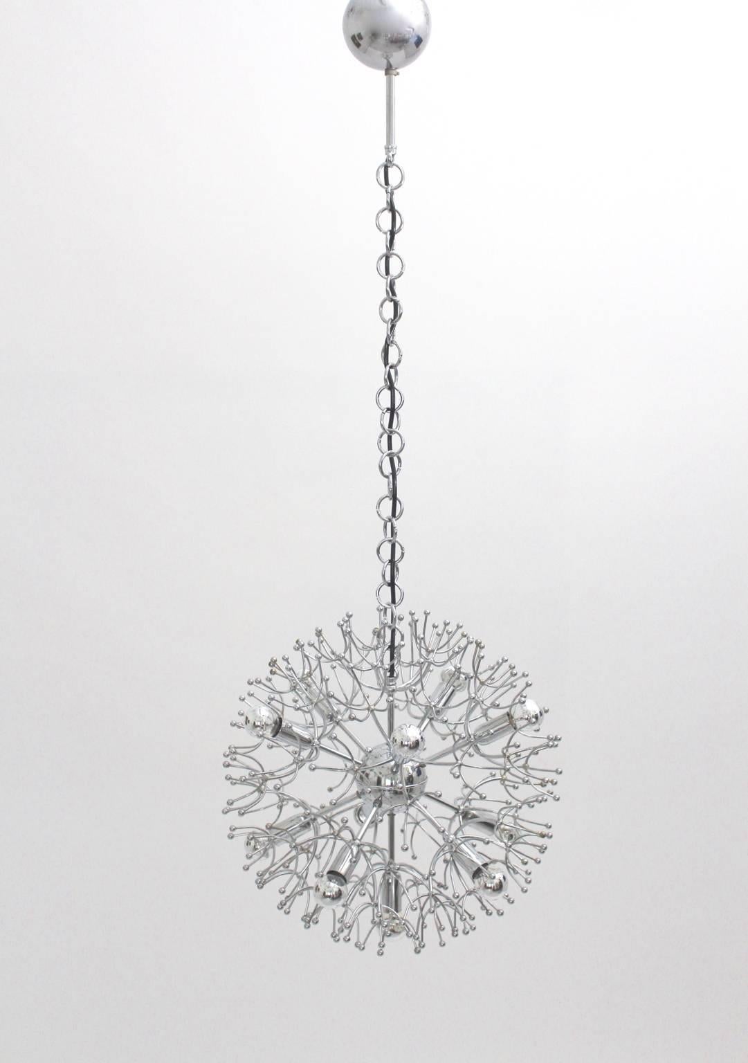 Space Age metal vintage chandelier or pendant from chromed metal by Gaetano Sciolari, Italy 1960s.
A fantastic chromium plated metal sputnik chandelier with 11 E 14 sockets , which is labeled with company´s name.
The sputnik chandelier shows good