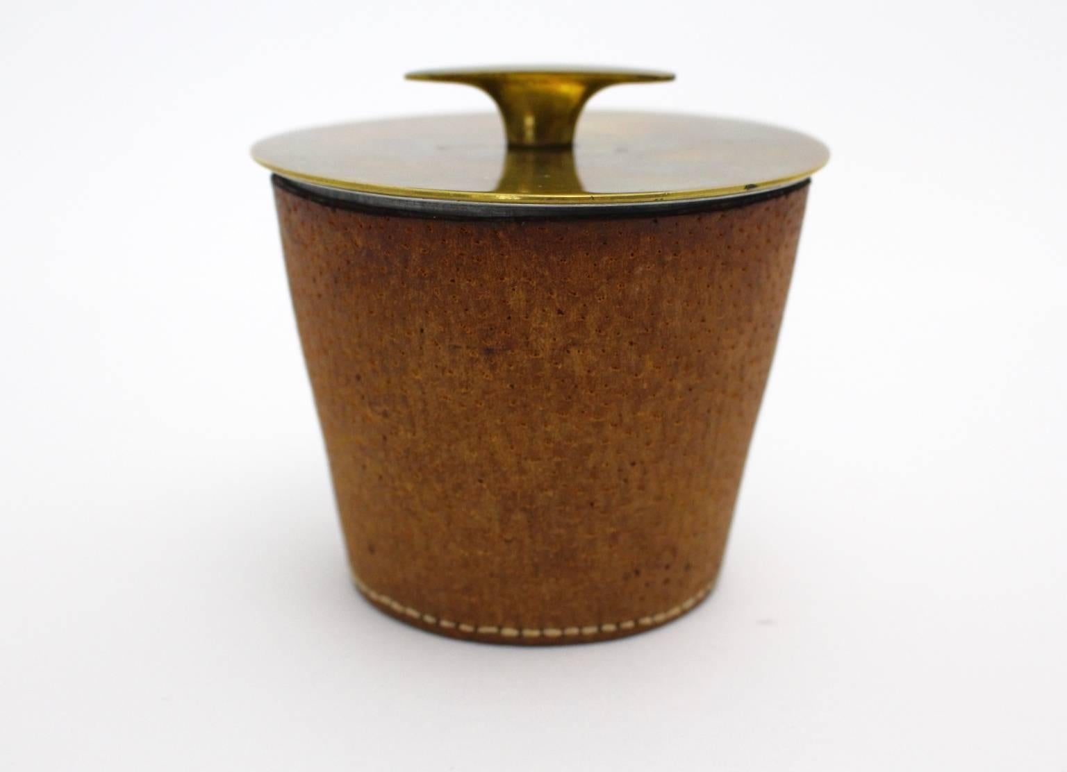 Leather covered aluminium box with patinated brass top by Carl Auböck, Vienna. This vintage leather box is also a great desk accessories.
Very good vintage condition with wonderful patina.
All measures are approximate.