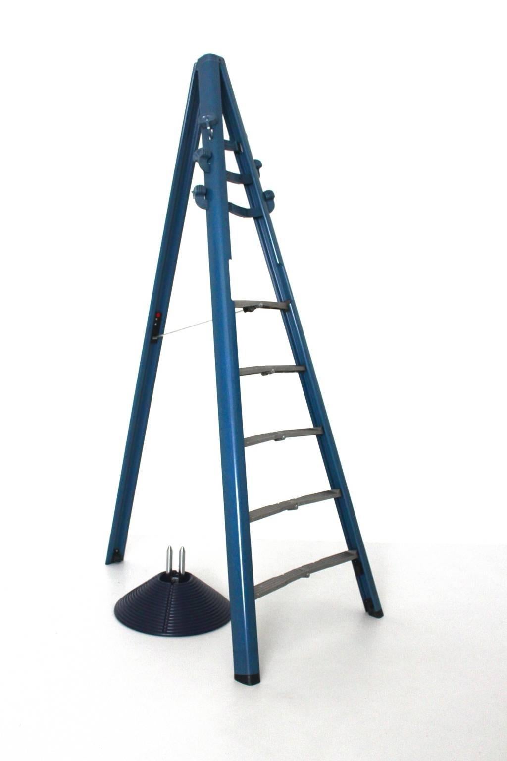 Modern blue vintage coat rack model Dilemma by Giancarlo Piretti and produced by Castilia, Castel S. Pietro (Bo), Italy 1984.
This amazing object features a coat rack and a ladder in one piece and could easily be transformed into a five steps