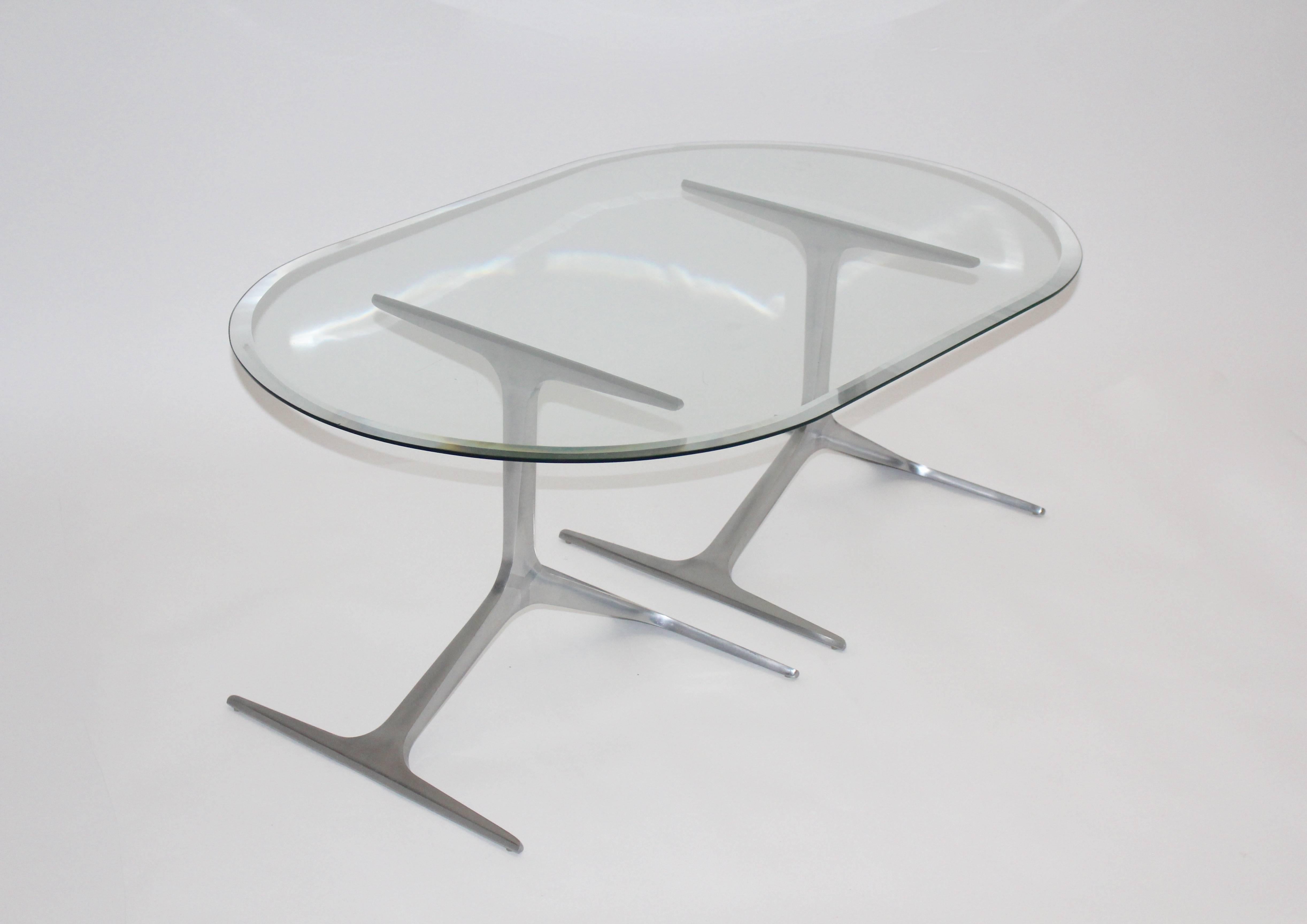 Mid Century Modern sculptural coffee table or sofa table from two aluminum elements base topped with a facetted clear glass plate. 
The mid century modern coffee table was designed by Knut Hesterberg 1960s and produced by Ronald Schmitt,