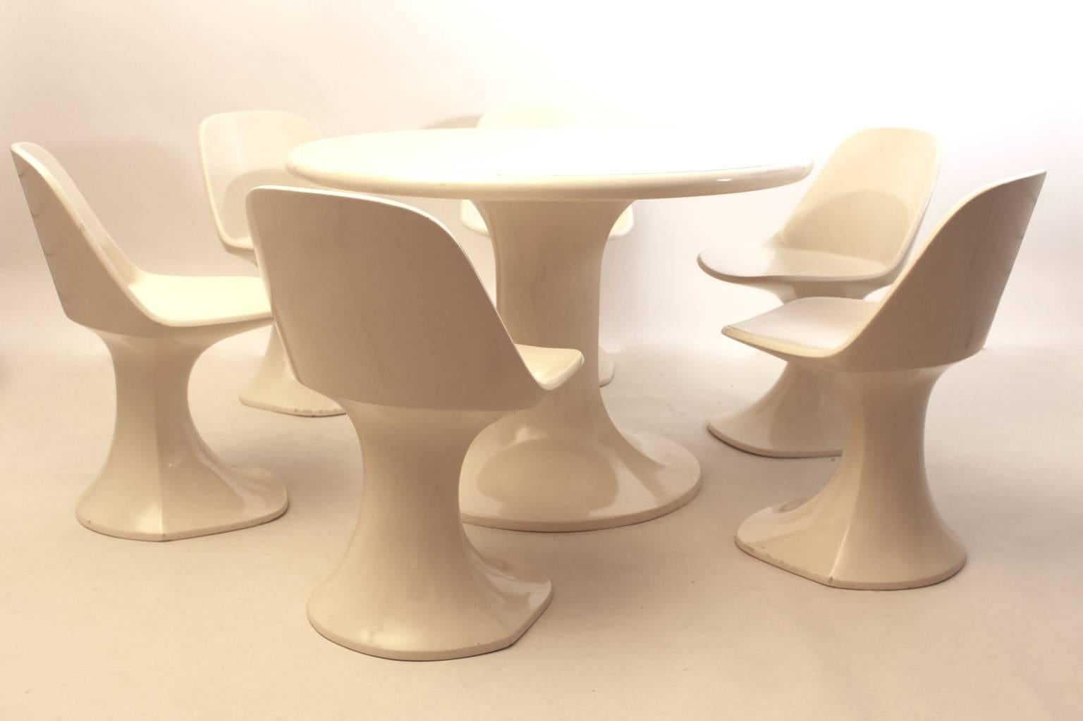 Space Age vintage Dining Room Set consists of a circular like  dining table and six matching sculptural dining chairs from white lacquered fiberglass  1970s by HT-Collection, Finland ( Huonekaluuluote )
All six dining chairs and the dining table are
