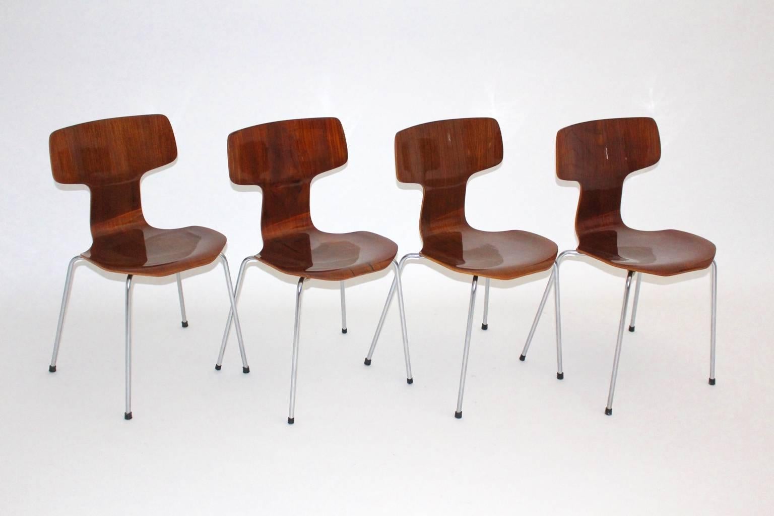 Mid Century Modern four plywood teak Model No. 3103 laminated rare stacking chairs, designed 1952 and just produced for 15 years only.
Carefully cleaned and hand-polished.
The iconic set of 4 dining chairs or chairs by Arne Jacobsen works well as