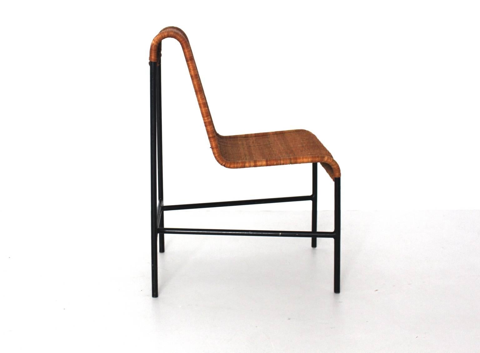 Mid Century Modern black lacquered tubular steel frame while the seat and back shows wickerwork.
Designed by Harold Cohen and Davis Pratt, USA, 1953.
Produced: USA, 1953.
lit: Scandinavian design beyond the myth, p. 55
very good condition
approx.