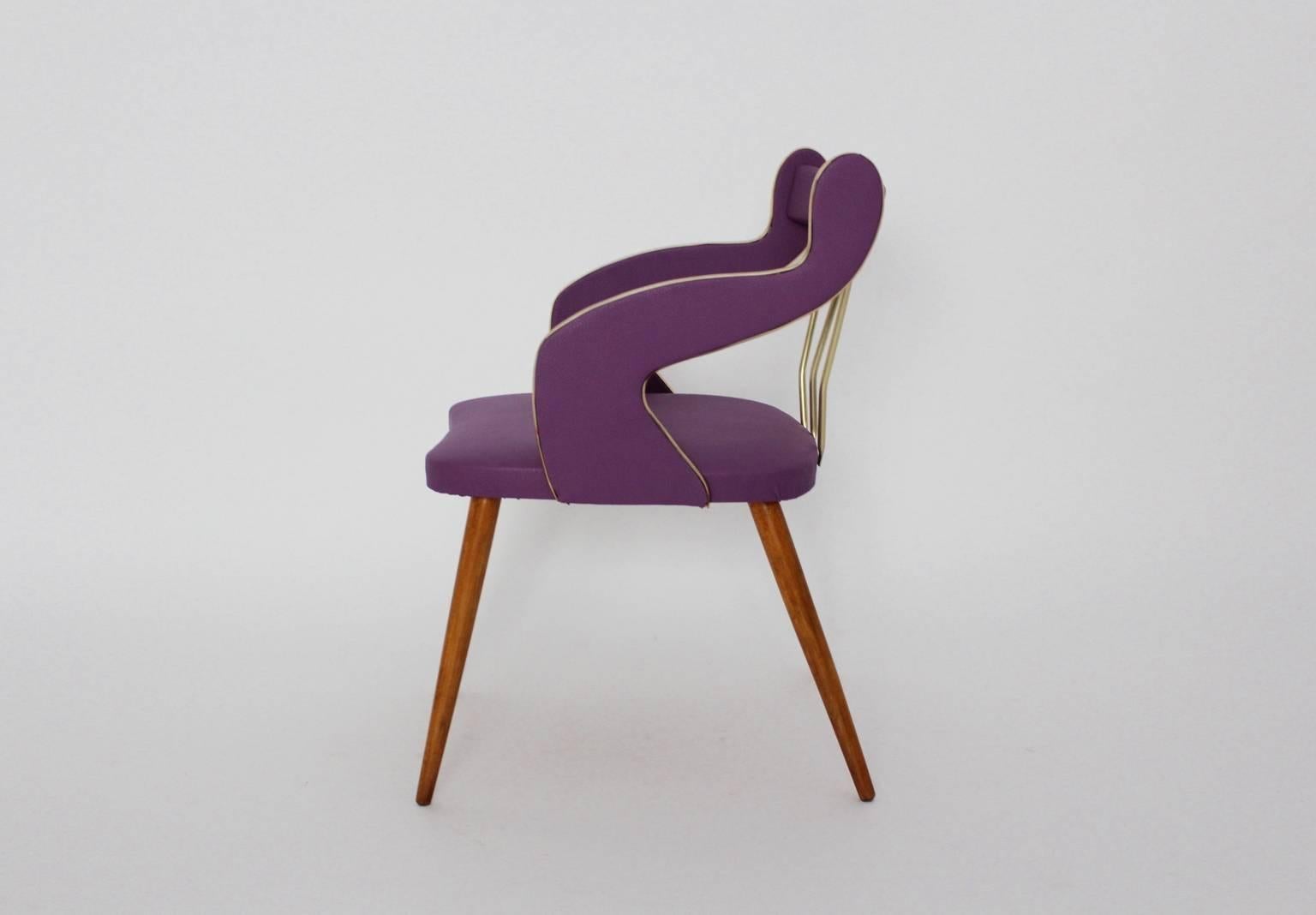 Mid Century Modern lilac vintage armchair or side chair designed in Italy circa 1950. 
A charming freestanding Italian armchair from solid beechwood and vivid lilac cover from faux leather.
This armchair shows a replaced cover from faux leather in