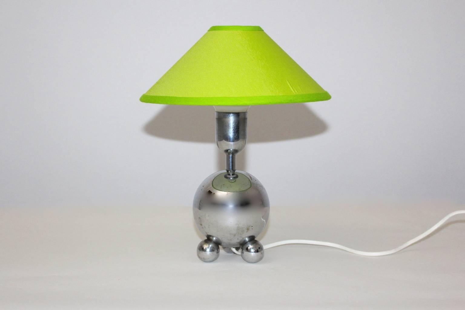 Mid Century Modern vintage table lamp from chromed metal designed and manufactured circa 1950 France.
A stunning graceful table lamp with a chromed base and a renewed lamp shade covered with lemon green textile fabric.
Furthermore the table lamp