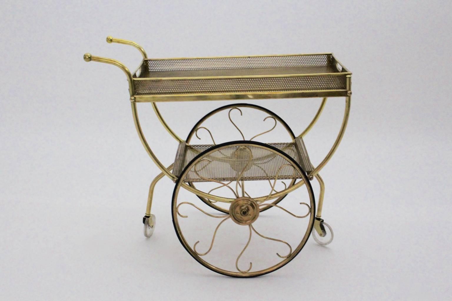 Mid century Modern vintage bar cart or serving trolley by Josef frank for Svenskt Tenn circa 1960 from brass and perforated brass.
An amazing bar cart with two perforated metal tiers, which are great to present your beloved precious things, while