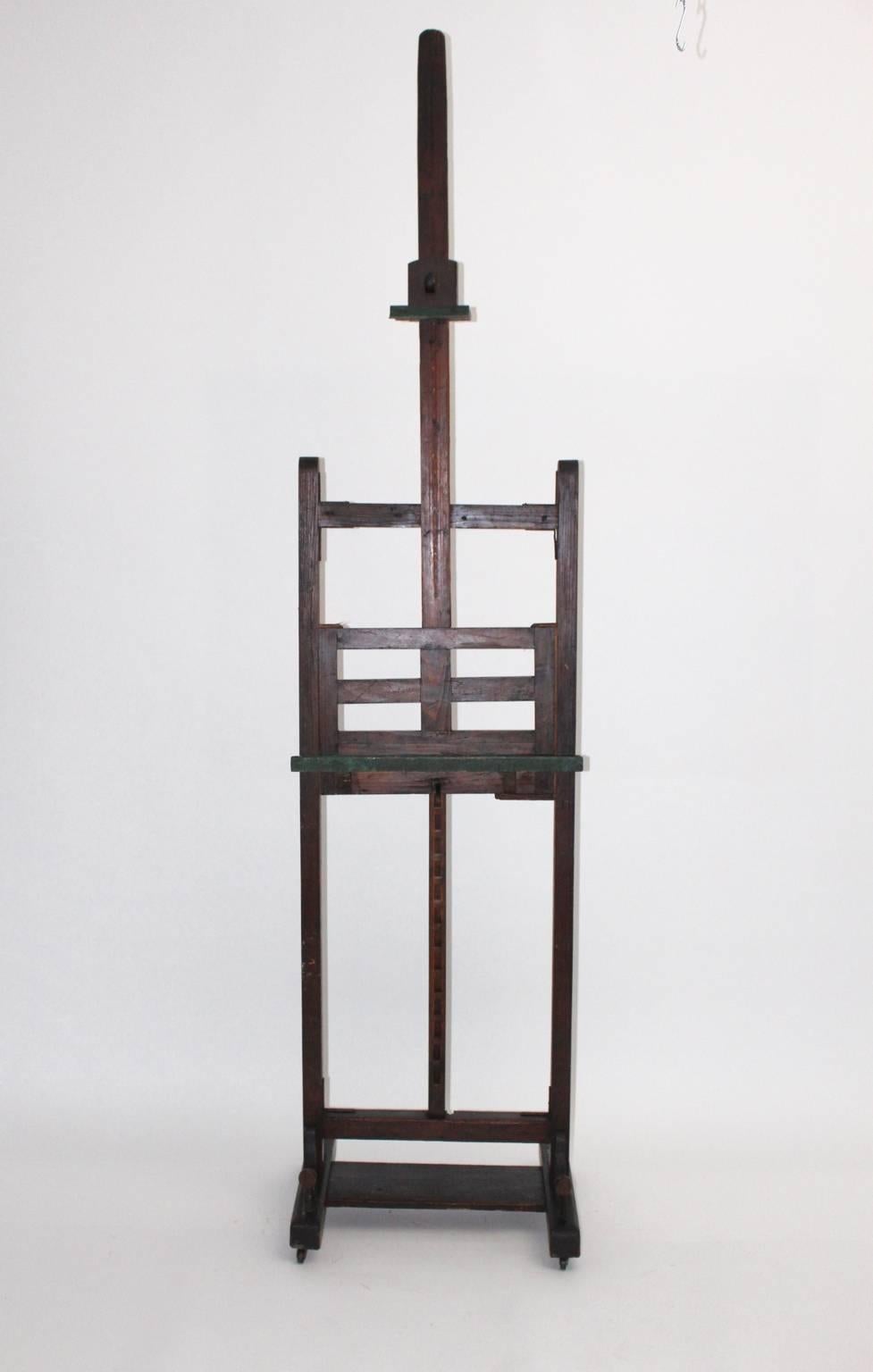Very decorative Art Deco Easel from an Austrian painter.

Spruce wood brown stained.
Original condition, beautiful patina with color rests.

Adjustable from up to down from 72.83 in to 98.42 in.
Suitable for large paintings. 

