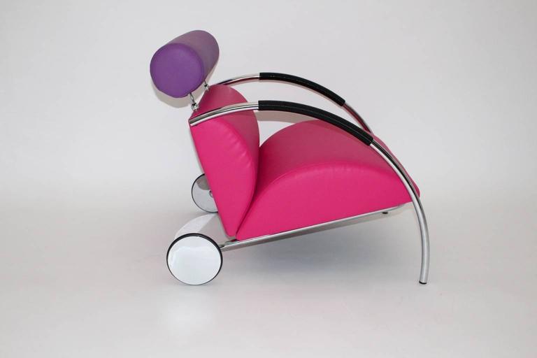 Postmodern Pop Art vintage pink violet vintage armchair lounge chair model Zyklus Chair designed by Peter Maly  1980s and executed by COR, Helmut Luebke.
This model of armchair was elected to the furniture of the year 1984.
This faux leather lounge