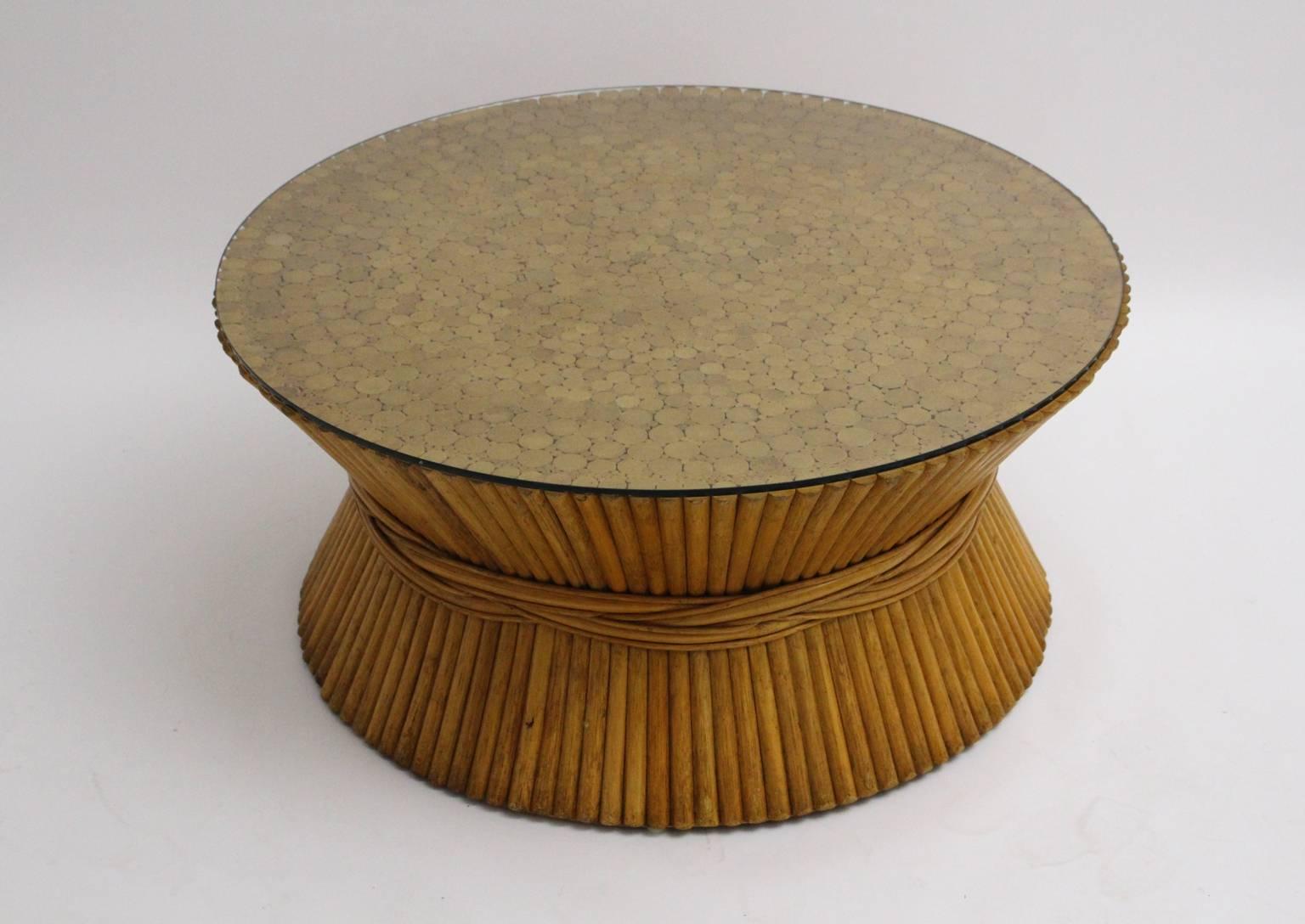 This presented vintage bamboo coffee table was designed by Mc Guire and features a sheaf of wheat with a round clear glass top in good condition.

The provenance is a private ownership in Vienna.

 