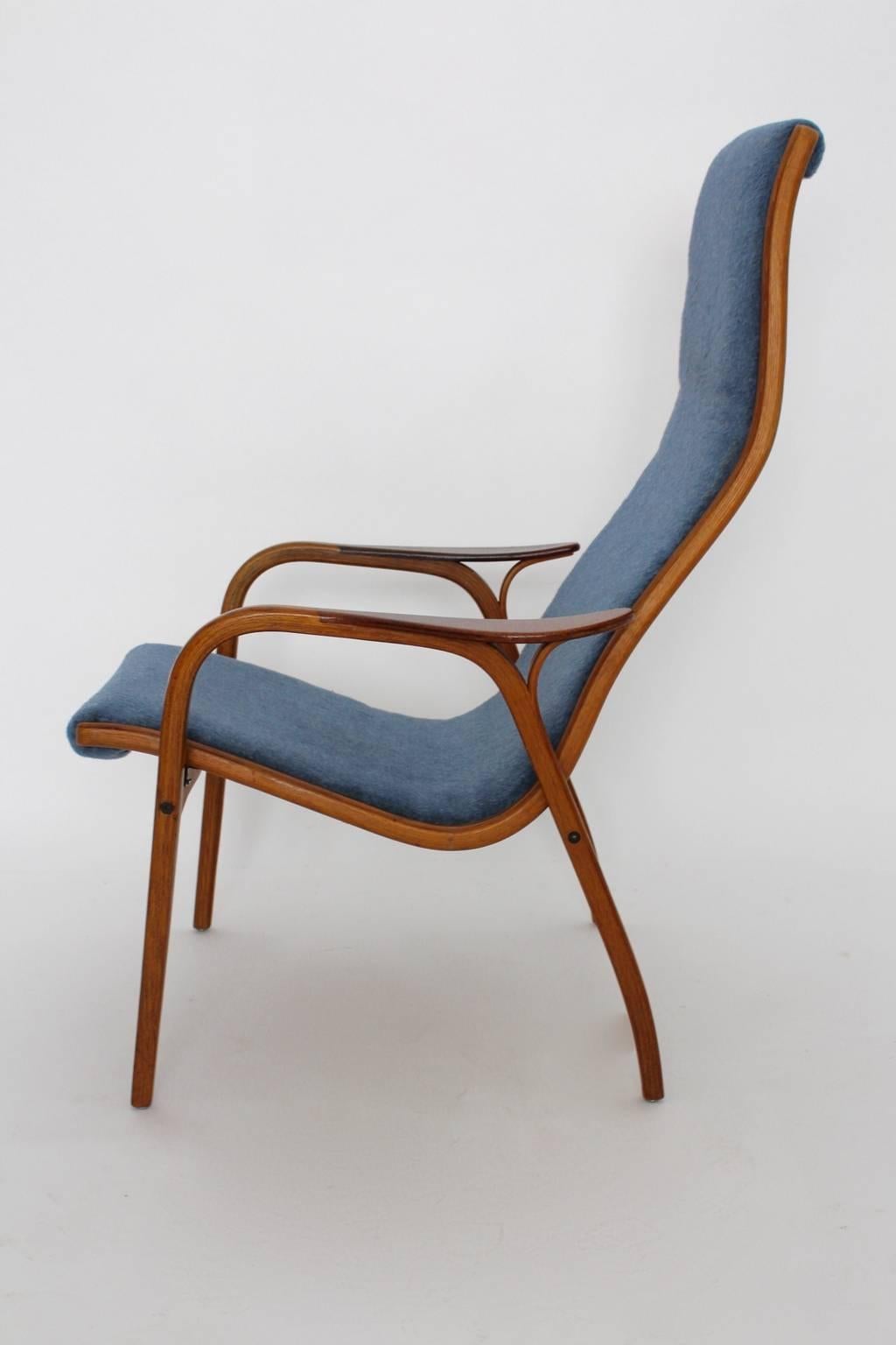 Lightweight lounge chair, which was designed by Yngve Ekström, 1950s and produced by Swedese, Sweden.

The seat frame of the lounge chair was made of teakwood and the seat shell was covered with sky blue woolen fabric.

The lounge chair is in very