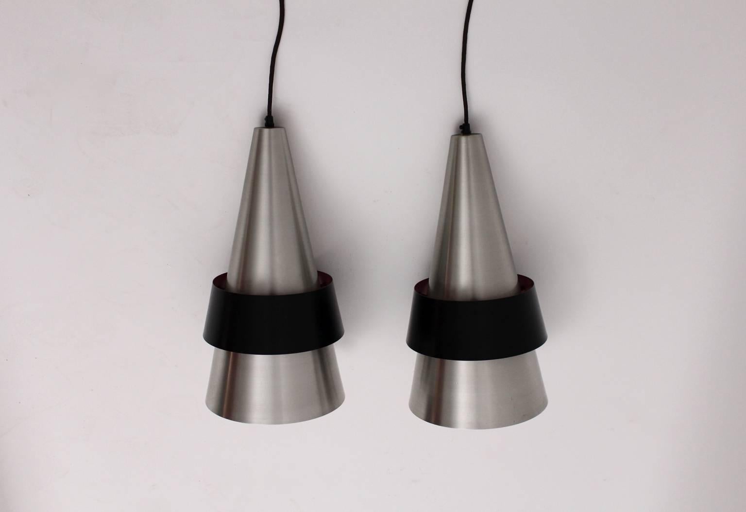 
The pair of Scandinavian modern vintage metal pendants Corona were designed by Jo Hammerborg, Denmark, 1960s and executed by Fog & Morup, Denmark.
Also these pendants were made of stainless steel and sheet metal black lacquered with plastic.
Each