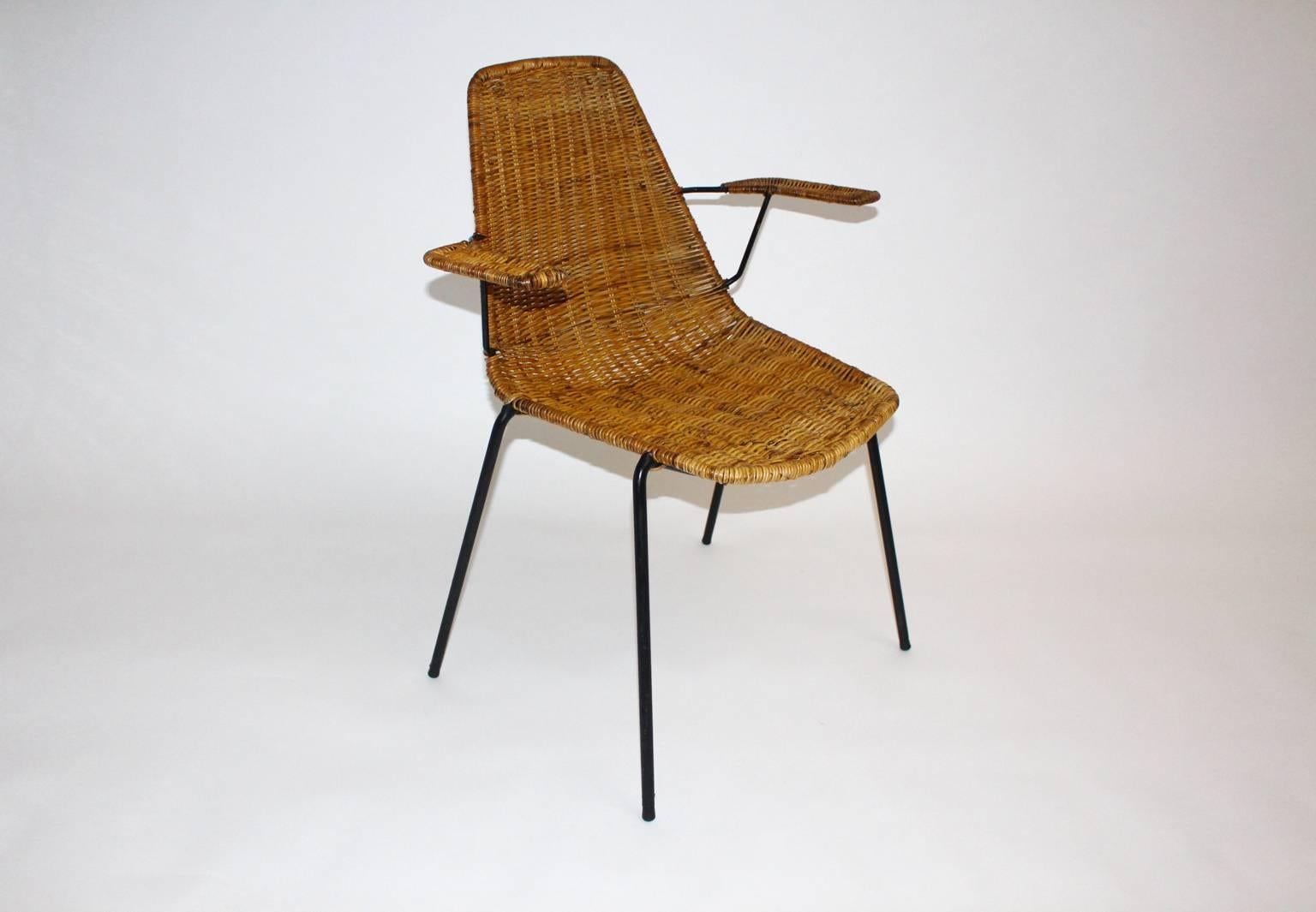 This armchair was designed by Gian Franco Legler, 1951, Switzerland, for an Italian restaurant called The Basket.
This design piece was honored with the Good Design Award from MoMA, New York;

The armchair is designed and executed in the Mid-Century