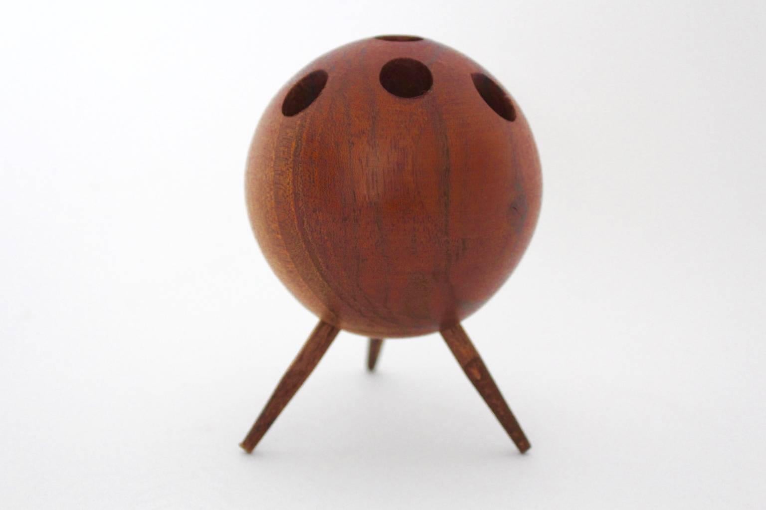The tripod candleholder was made of walnut and shows seven holes for small candles.
This piece was designed circa 1960.
The candleholder is in very good condition.