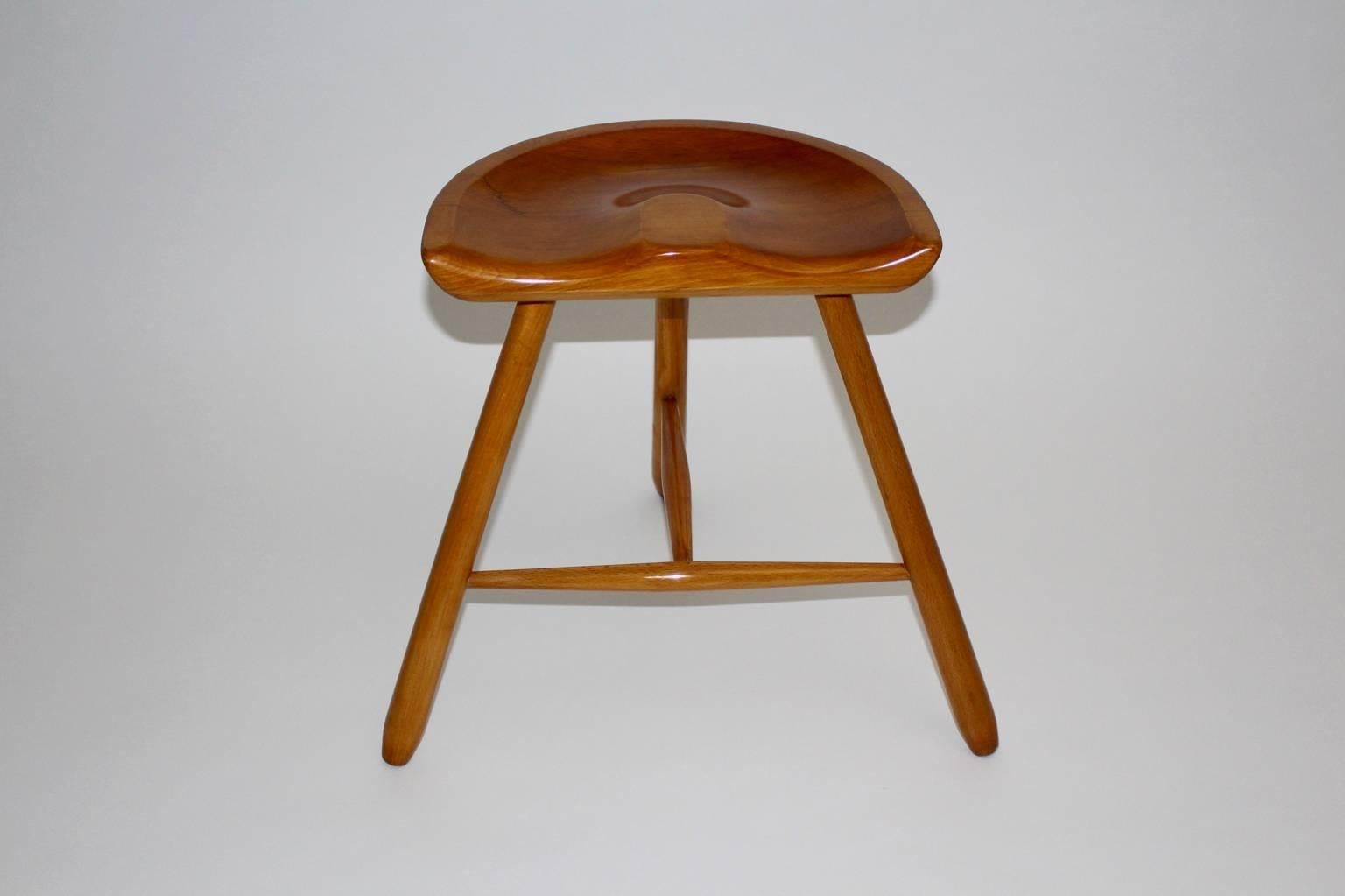 Art Deco vintage brown three-legged stool from solid maple tree. The beautiful stool with the warm brown tone features a saddle seat.
This stool is attributed to the Wiener Werkbund circa 1933, Vienna
Carefully cleaned and shellac hand-polished, so