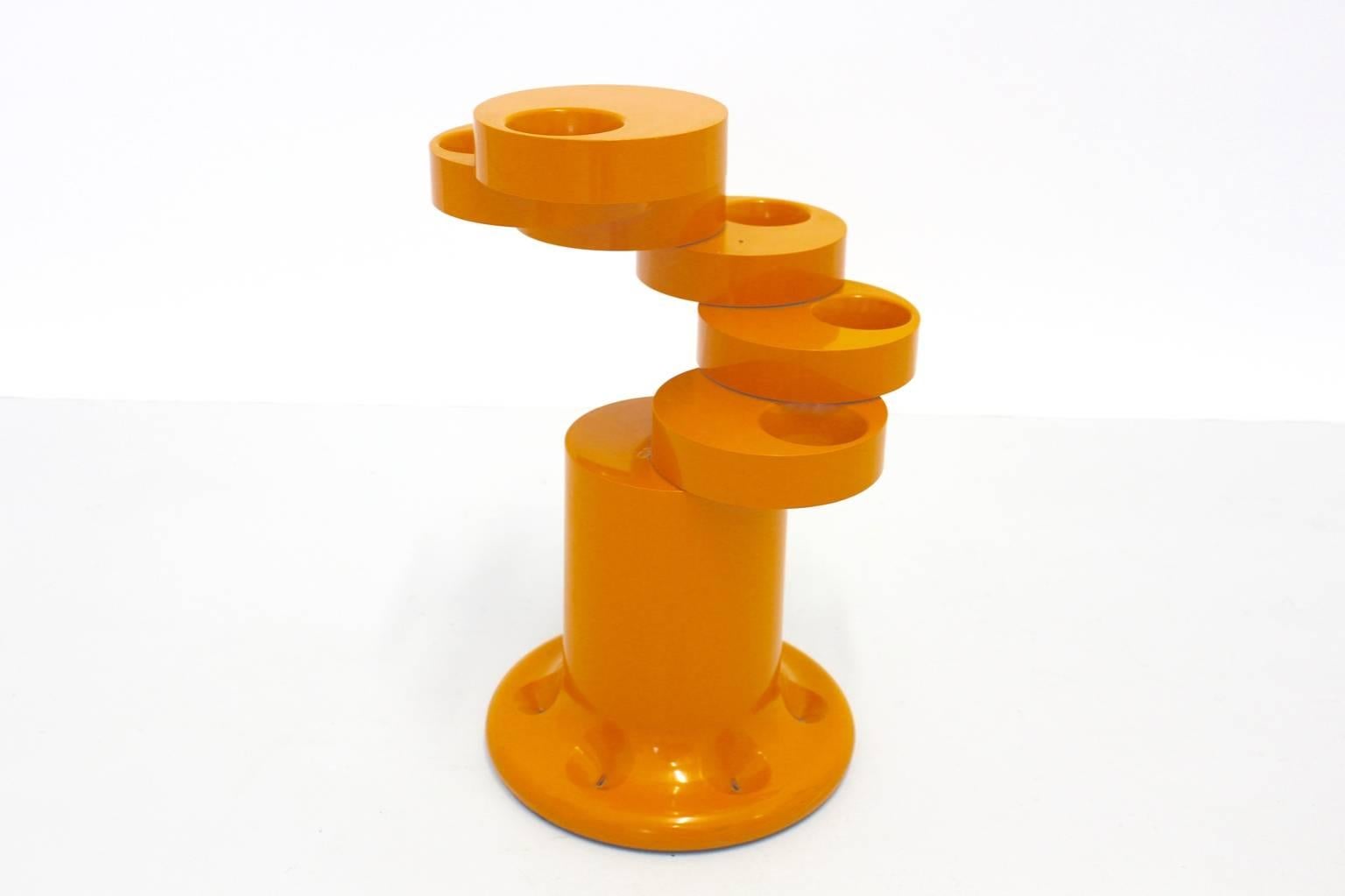 Orange umbrella stand named Pluvium designed by Giancarlo Piretti and executed by Aanonima Castelli, Italy, 1960s.
An amazing umbrella stand from plastic in orange color created to hold six umbrellas when the umbrella stand is folded up.
Also to