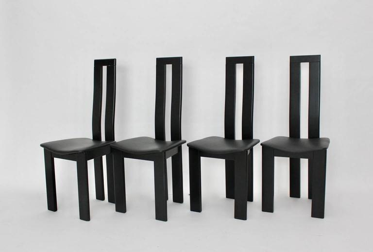 Mid Century Modern vintage set of four black dining chairs designed by Pietro Costantini from solid black lacquered beechwood.
The seats are newly covered with black leather.

The condition of the dining room chairs is very good with minor signs of