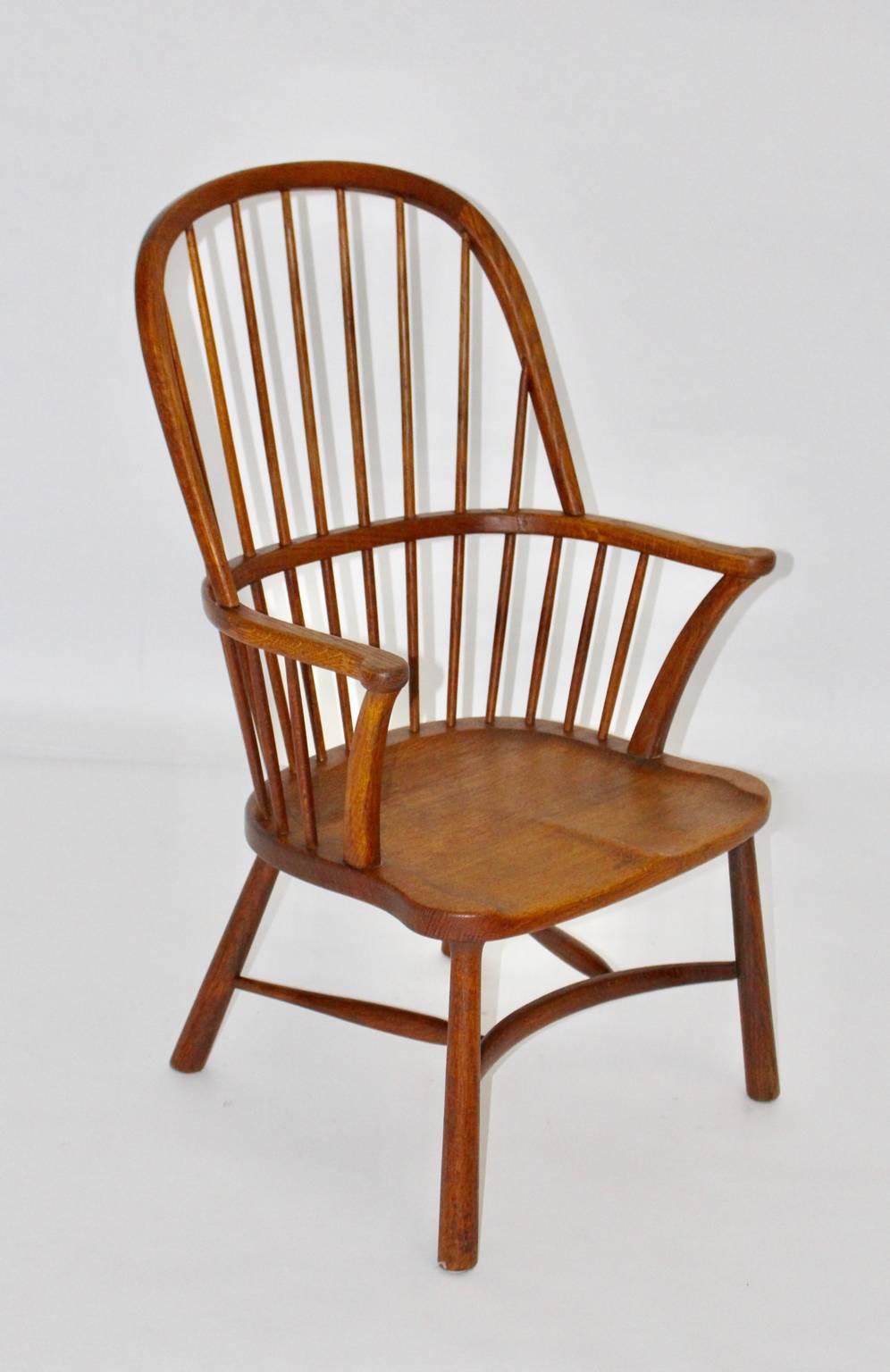 Art Deco Era Windsor chair design attributed to Walter Sobotka Vienna 1932.
The WIndsor chair from solid oakwood features a saddle seat and conical feet. 

Walter Sobotka (1888 Vienna - 1972 New York) has a leading position in 1929 and also from