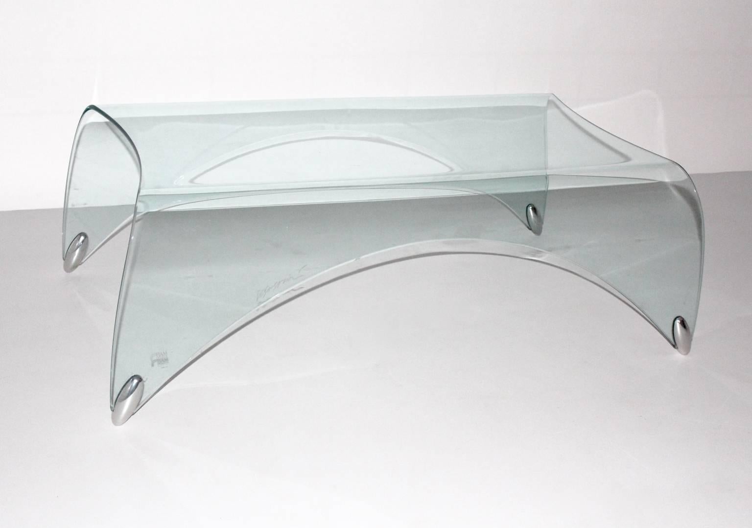 Modernist vintage security glass coffee table or sofa table by Massimo Iosa Ghini and executed by Fiamm, Italy
The coffee table shows a beautiful form like a waterfall.
While the coffee table features sleek design it will work as well classic