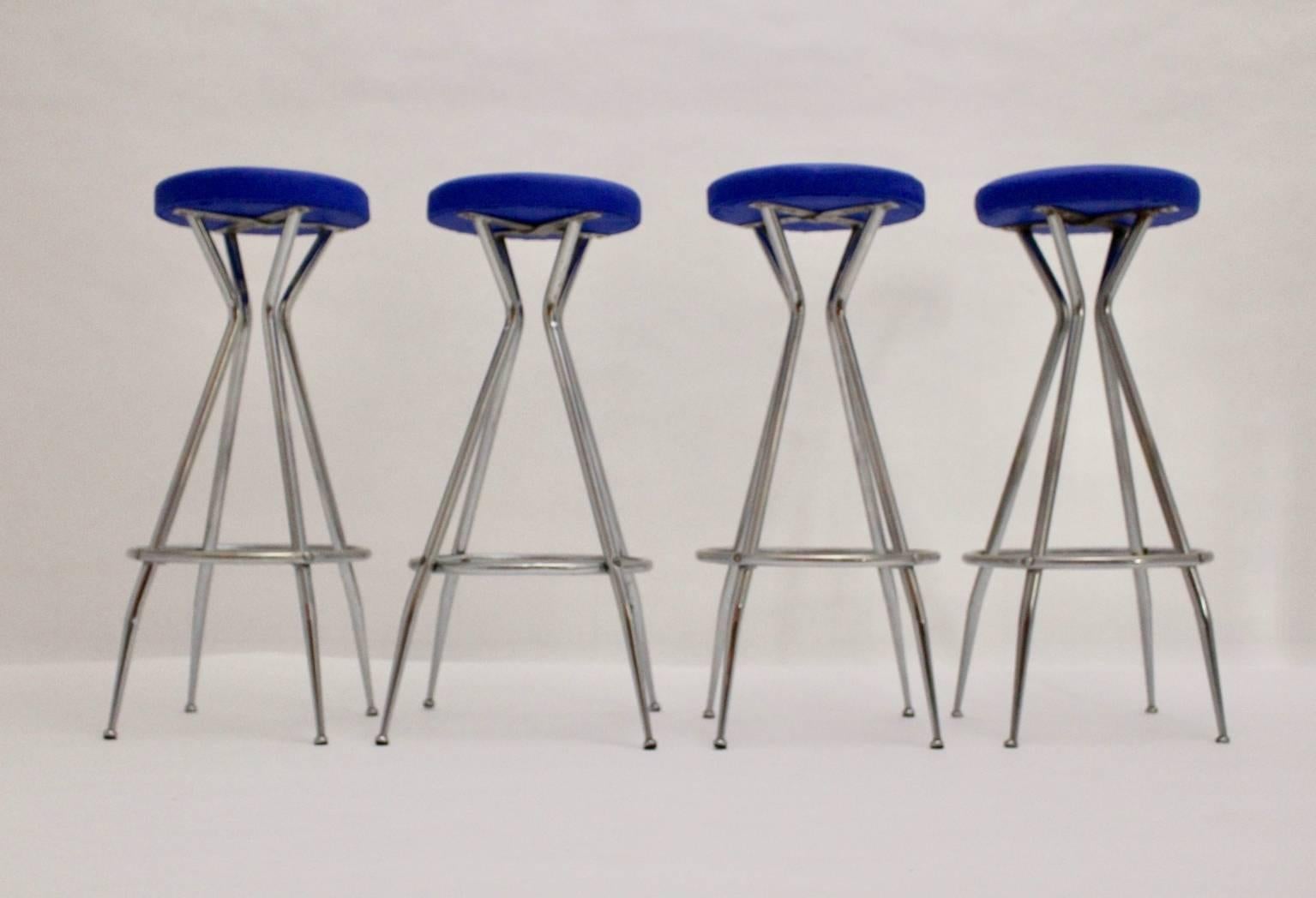 Mid Century Moder set of 4 barstools from chromed tube steel 1950s Austria.
The seat is covered with faux leather in a bold blue color tone.

The surface and the base of this set is in very good condition. The base has minor signs of age and