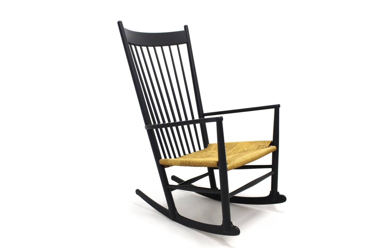 The rocking chair J 16 was designed by Hans Wegner 1944 and manufactured by Mobler F.D.B. Denmark 1964 marked.

The seat frame is made of black lacquered beechwood and the seat is made of string mesh.

The condition is very good with minor signs of