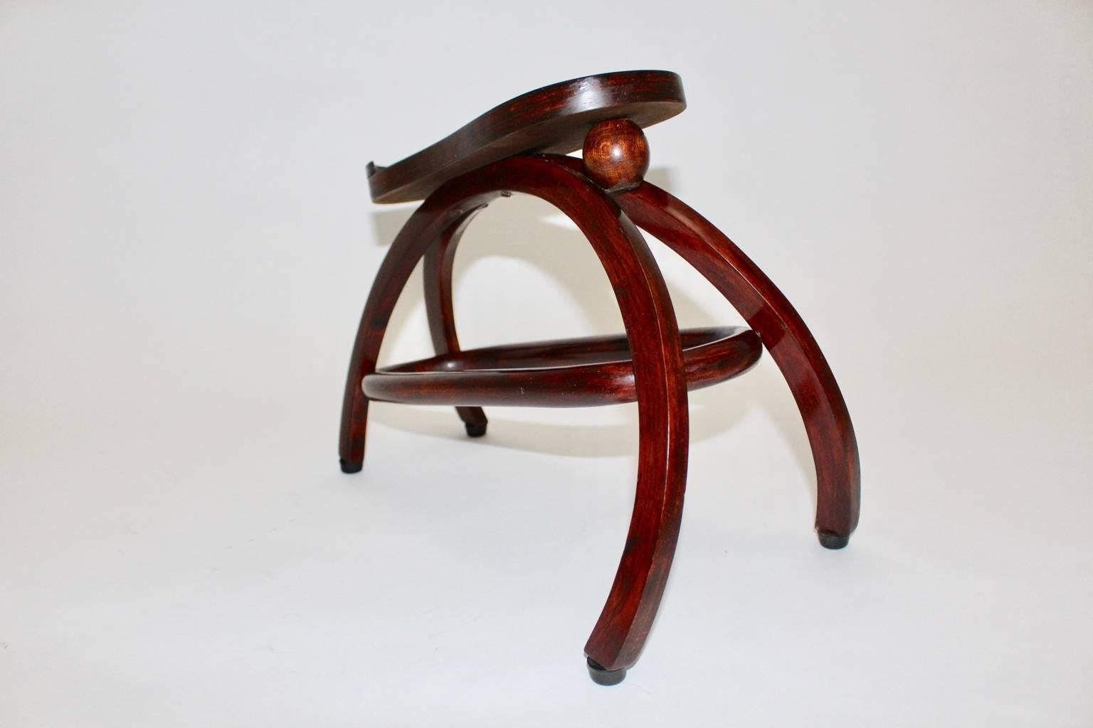 A very rare Jugenstil shoe stool by Josef Hoffmann designed circa 1907 
and executed by Gebr. Thonet Vienna.
The material is mahogany stained bentwood, while the surface is newly hand-polished with shellac.
Best condition !
A special feature is the