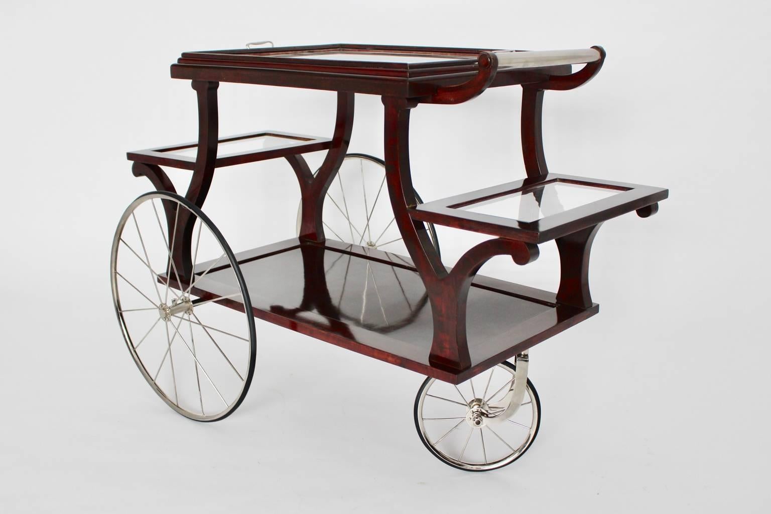 Jugendstil bar cart from stained beech designed and executed, circa 1902 in Vienna.
This type of bar cart was used by Adolf Loos for his interiors.
It features three nickel-plated spoke wheels with rubber and nickel-plated fittings.
The base is made