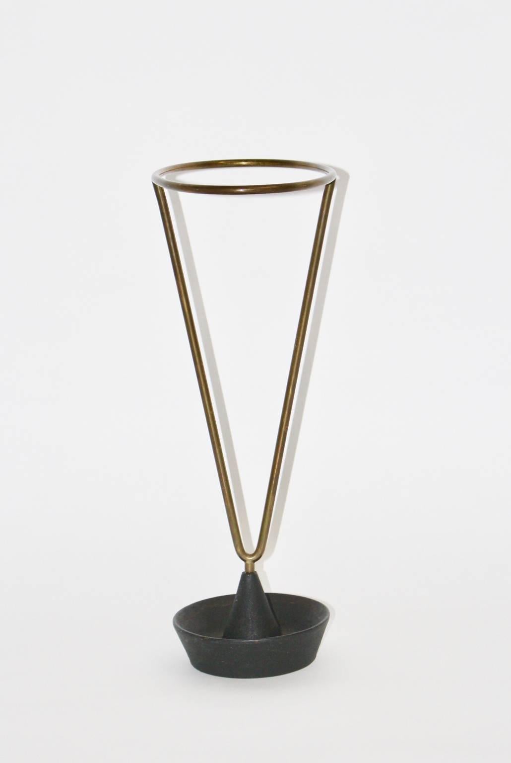 Simple, elegant and timeless design by Carl Auböck!

The umbrella stand was made of cast iron and brass.
The original condition is very good with a great patina.
