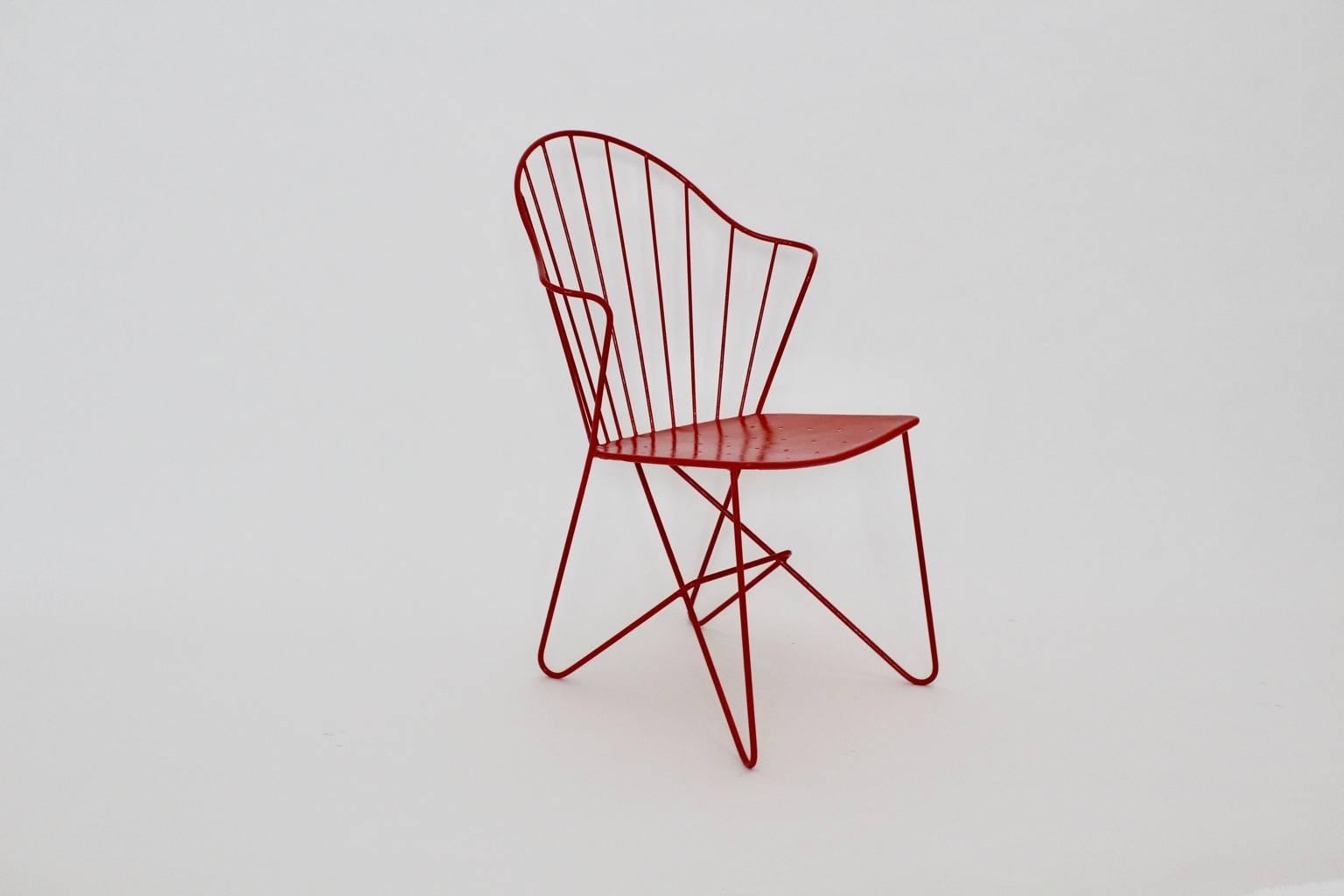 Red mid century modern side chair or chair model Astoria designed by the architects J.O. Wladar & 
 V. Moedlhammer circa 1955 and executed by Sonett Karl Fostel Sen.´s Erben, Vienna.
The wire steel chair is newly lacquered. 
all measures are