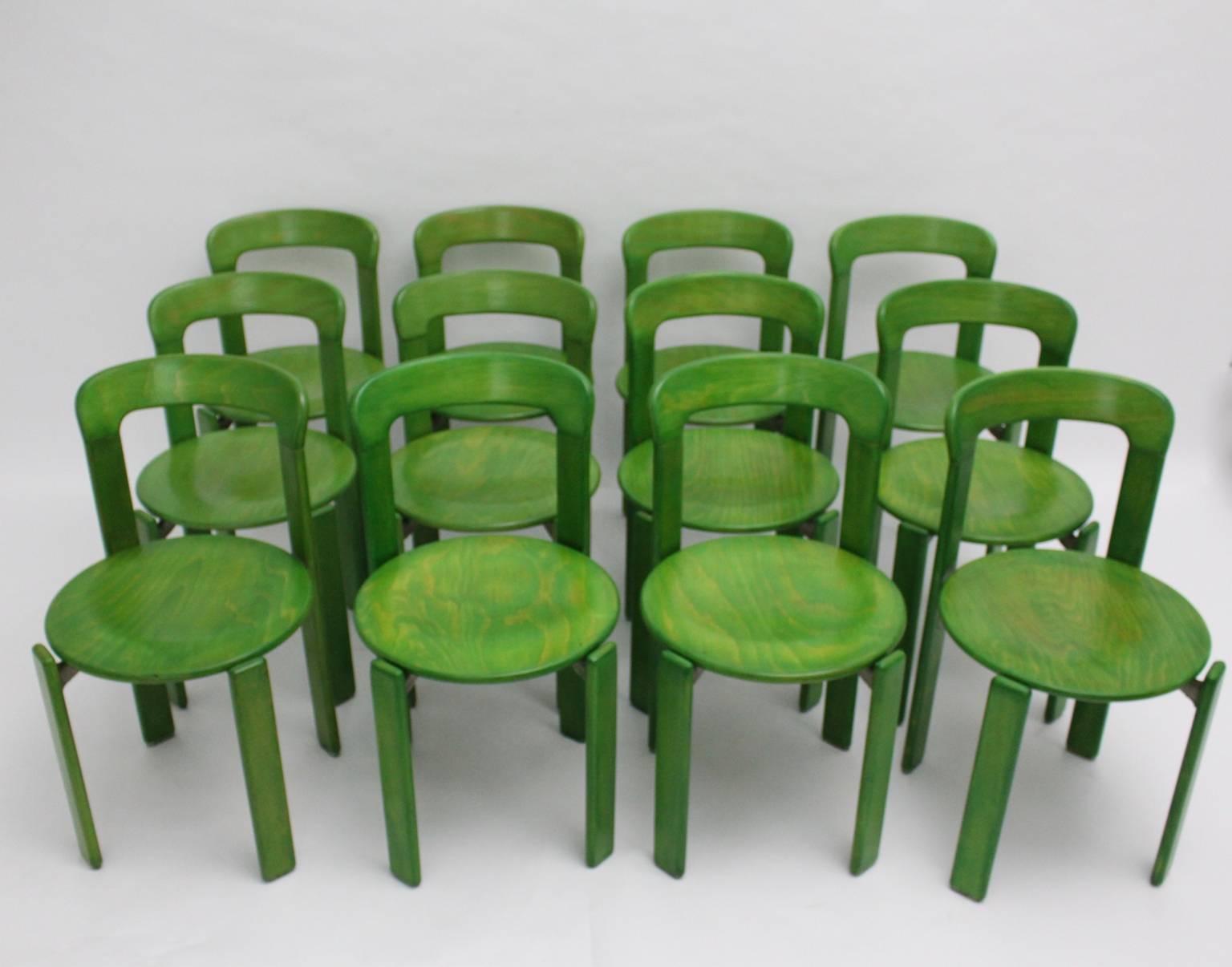 We offer a set of 12 dining room chairs in green color.

These dining room chairs are also stackable.
The dining room chairs were designed by Bruno Rey 1970s, Switzerland and executed by Kusch & Co, Germany.

The dining room chairs were made of