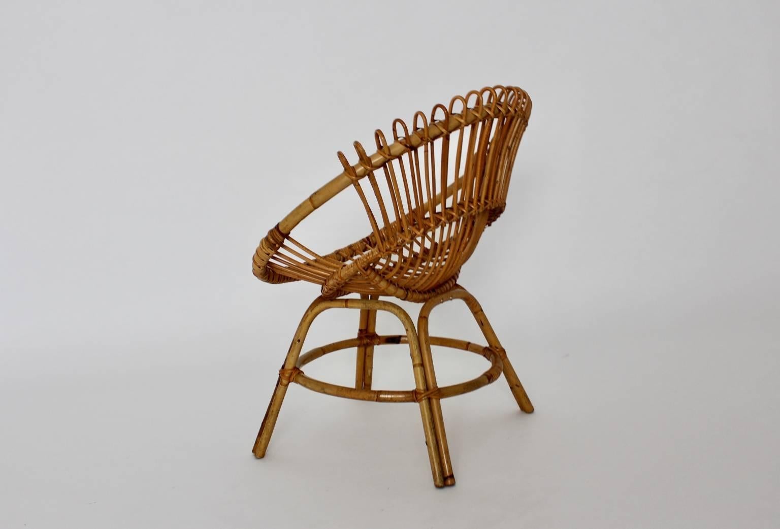 Mid Century Modern Riviera Style rattan armchair designed by Janine Abraham & Dirk Jan Rol attributed. 
France, 1960s
The original condition of this charming armchair is very good and shows no damages.

 