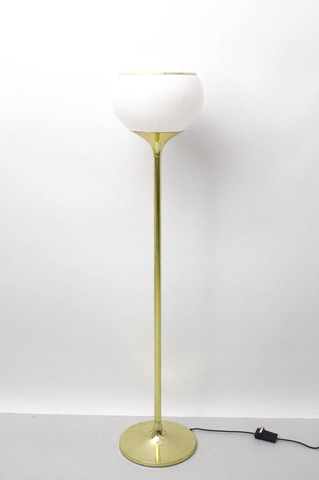 Space age vintage floor lamp was designed by Harvey Guzzini and produced by Meblo, Italy, circa 1970.
The floor lamp consists of brass and perspex and attracts with its simple design.
Labeled with the company name Meblo.
One socket for one bulb E