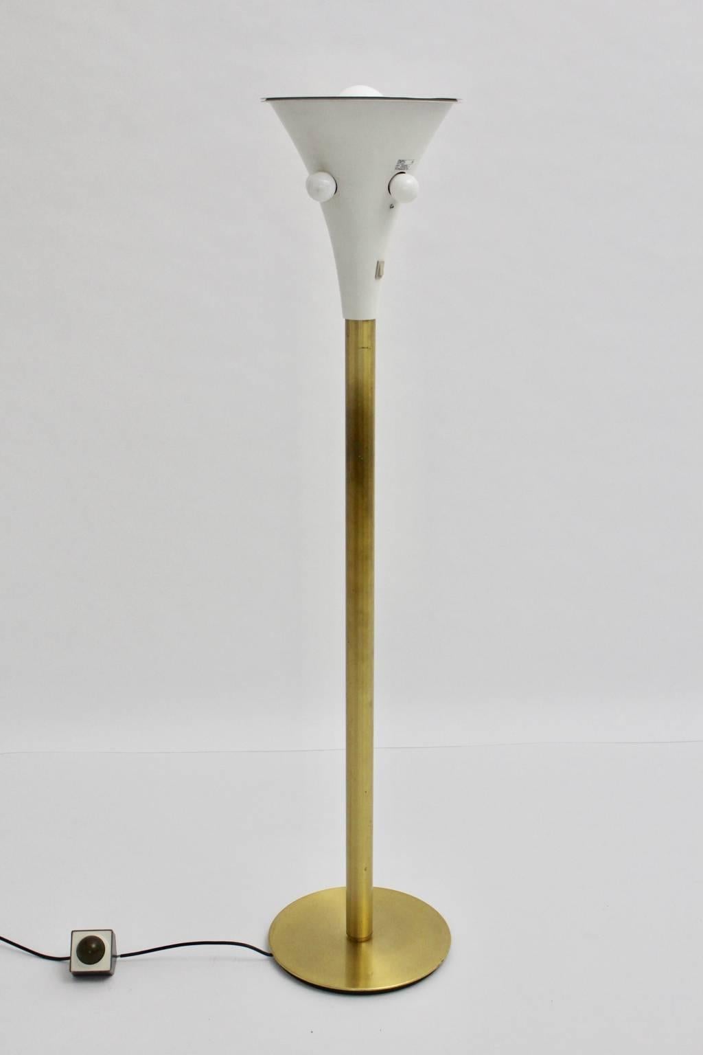 Mid century modern vintage floor lamp or uplighter by Staff Leuchten Germany 1960s with five sockets E 27, consists of cast iron, aluminium golden lacquered and aluminium white lacquered.
One central foot switch for all five bulbs to switch off