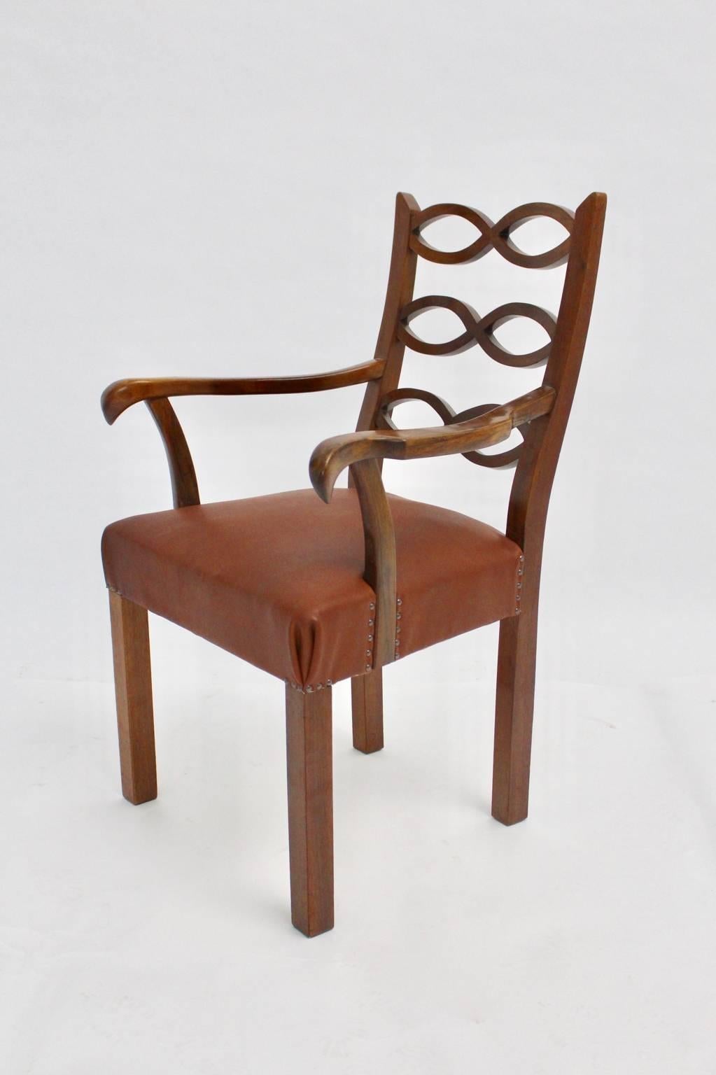 Art deco vintage armchair from walnut and leather designed by Hugo Gorge, circa 1920 in Vienna.
Hugo Gorge was an Austrian architect and a member of the Werkbund.
Especially to mentioned is his work and design for the Austrian Werkbund in