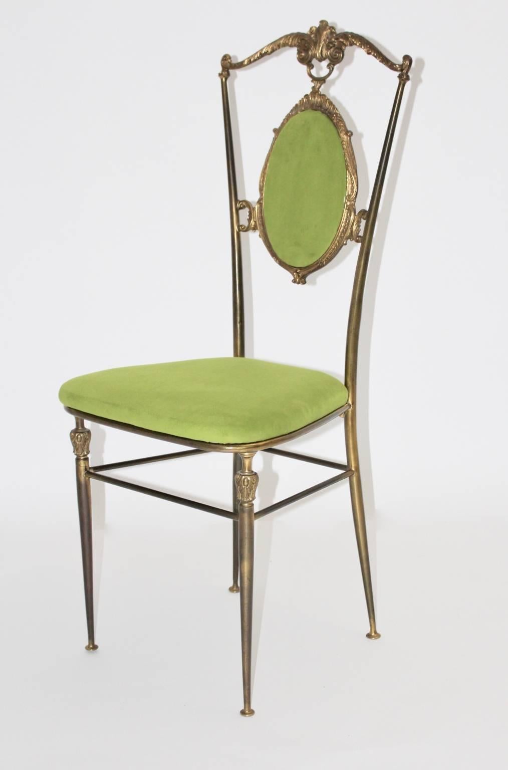 This Chiavari brass chair was designed and executed in the 1950s in Italy.
The back of the chair shows an upholstered medallion.
The seat and the back are newly covered with a light green velvet.

Measure: Seat height is 45.5 cm.
all measures are