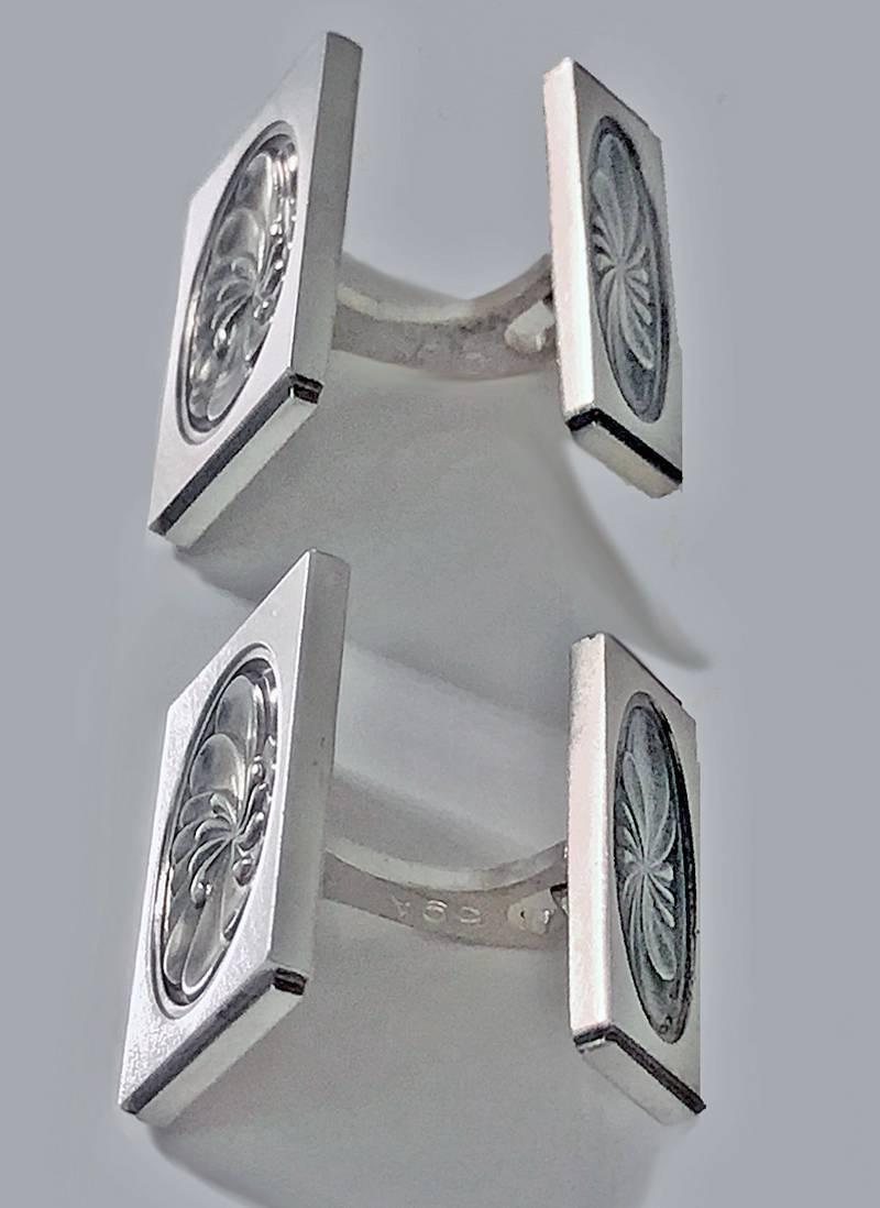 Pair of sterling silver Georg Jensen Cufflinks, #59A, Denmark, post 1945, designed by Henry Pilstrup. The cufflinks, lotus design, of rectangular shaped double sided form with oval foliage concave centre. Each stamped Sterling Denmark Georg Jensen