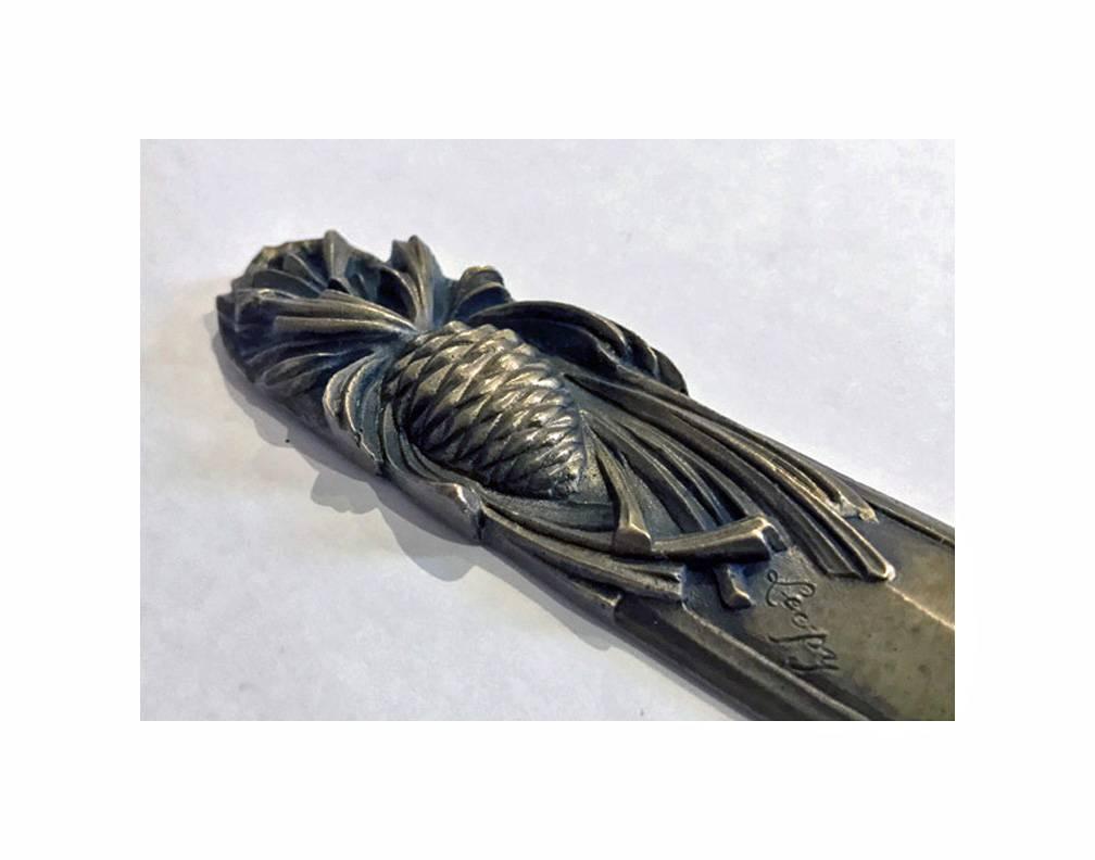 Art Nouveau bronze letter opener, circa 1900. The opener with pine cone design. Length: 7.5 inches.