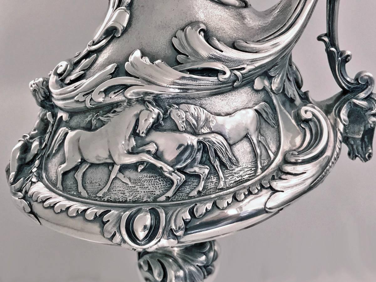 Outstanding silver equine related wine ewer jug, Edward & John Barnard, London, 1864. The Ewer of an undulating almost proto Art Nouveau form, richly embellished scroll and shell foliage against part stippled background. Original gilded interior.