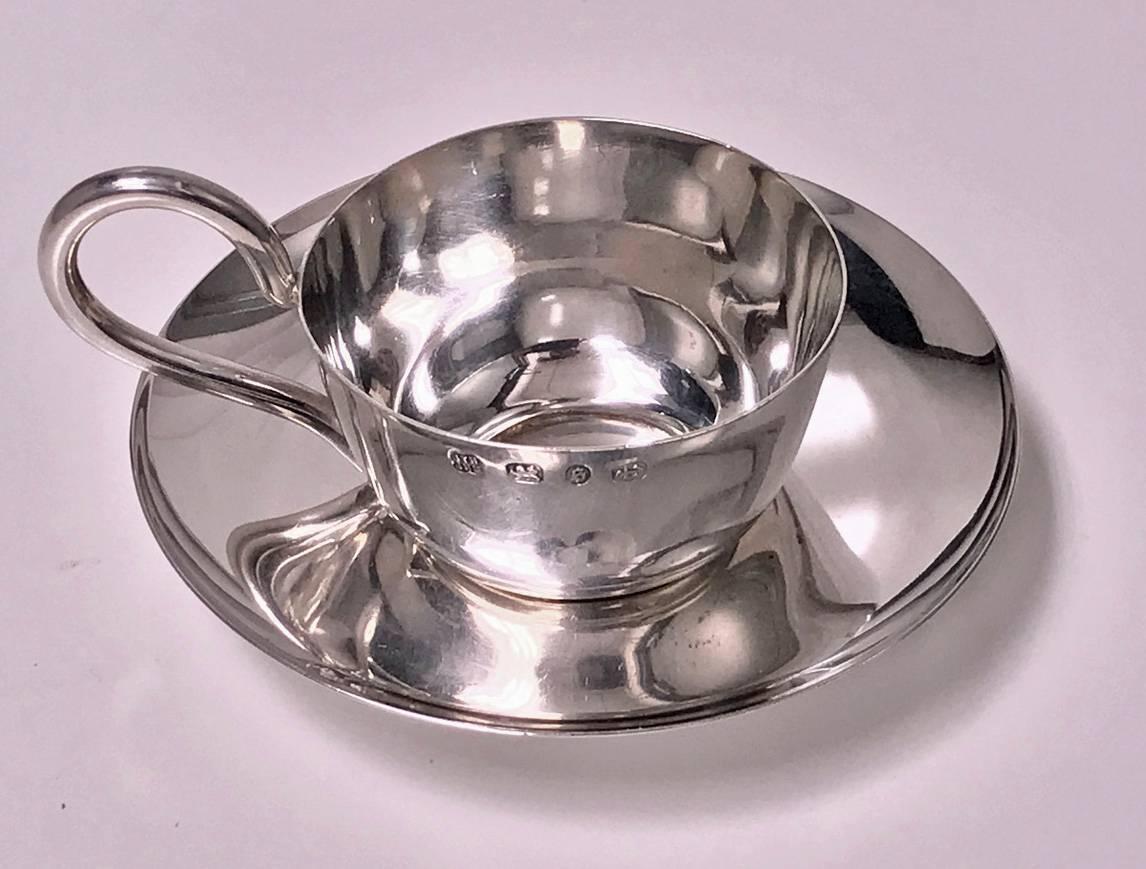 Rare Christopher Dresser designed miniature cup and saucer, hallmarked 1892-1894, Hukin & Heath. The cup of plain, slightly tapered, plain curve handle, saucer plain welled. Cup and Saucer fully hallmarked for Birmingham 1894 and London 1892 by