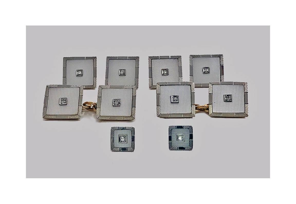 Mother-of-pearl 18-karat Tuxedo Cufflinks dress set, English, circa 1930. The set comprising pair of Cufflinks, four buttons and pair of collar studs. Each square shape centring a single cut diamond on engine turned design mother-of-pearl, the outer