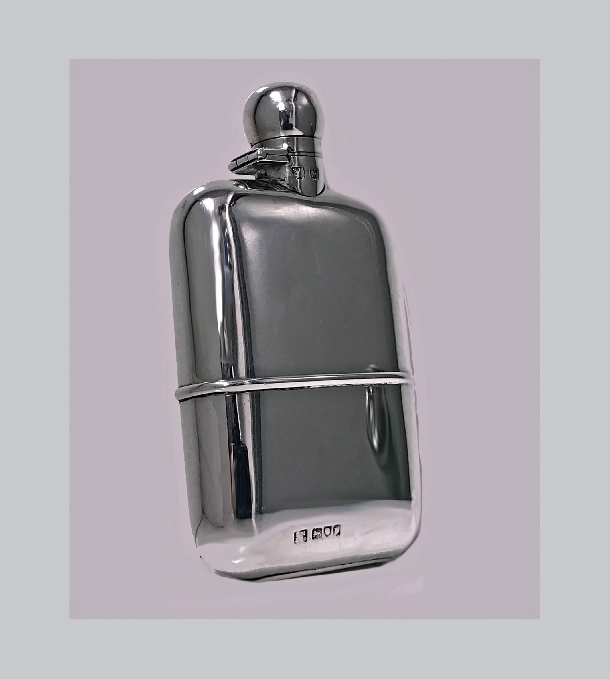 English sterling silver flask, London, 1914, Sampson Mordan Co. The flask of plain convex form with detachable silver cup, bayonet twist top. Fully hallmarked. Measures: 5 x 2.5 x 1 inches. Weight 141.73 grams.