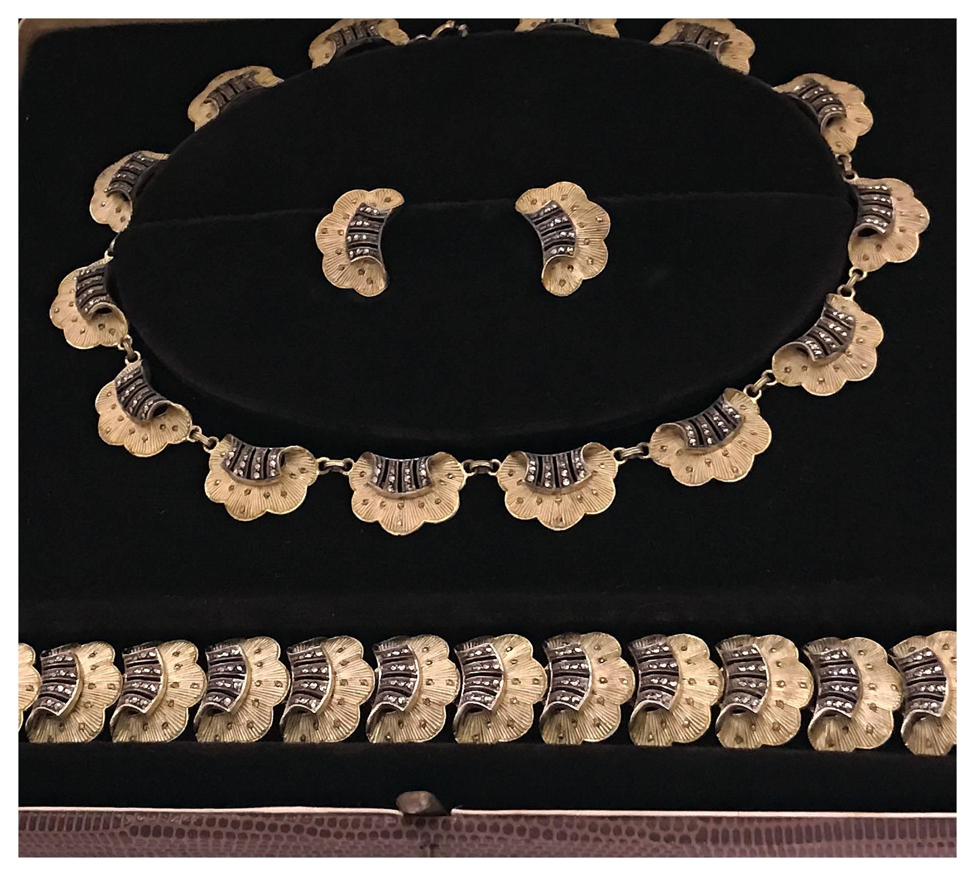 Wonderful 1930s Theodor Fahrner silver vermeil and marcasite suite of necklace, bracelet and earrings all in original fitted box. Designed by Fahrner who was one of the foremost Art Deco jewelry makers, based in Pforzheim, Germany. Measures: