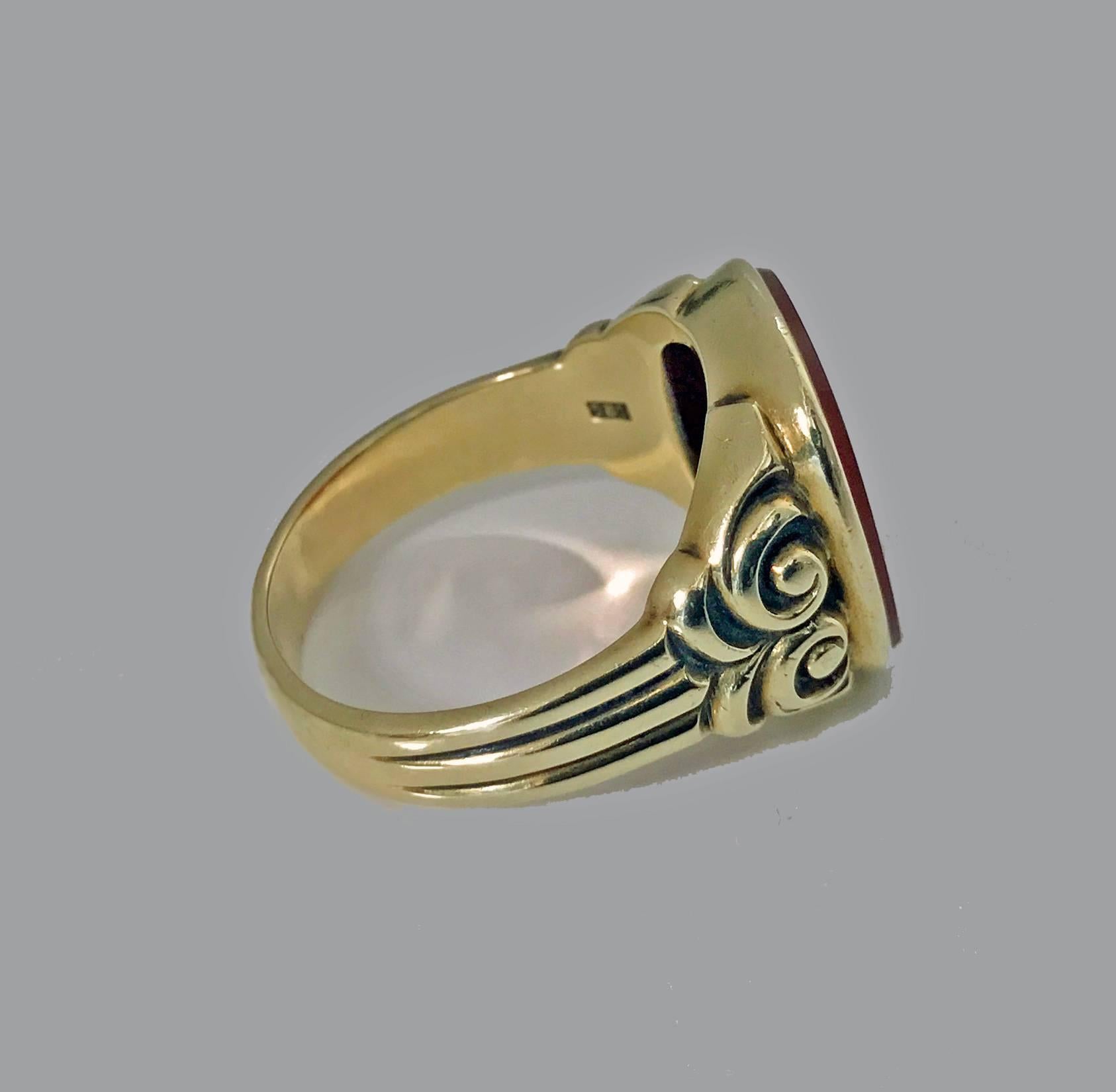 Antique gold carnelian ring, circa 1890. Nice large size, unengraved lively orange carnelian, Measures: approximately 16 x 14 mm, carved and ribbed shoulders, plain shank. Stamped 585. Ring size: 10.25. May be sized. Item weight: 8.10 grams.