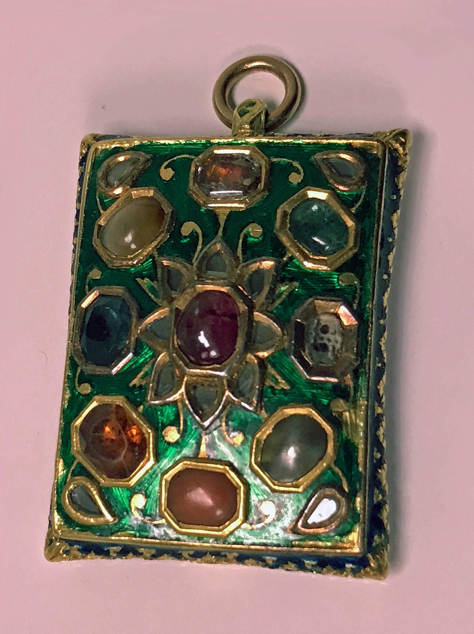 Antique Indian Gold (acid tested 22K) Gem set enamel Pendant, possibly North Indian, 19th century. The rectangular convex plaque decorated to the front with various gems representing the 9 plants of the Hindu astrological system, the Navagraha