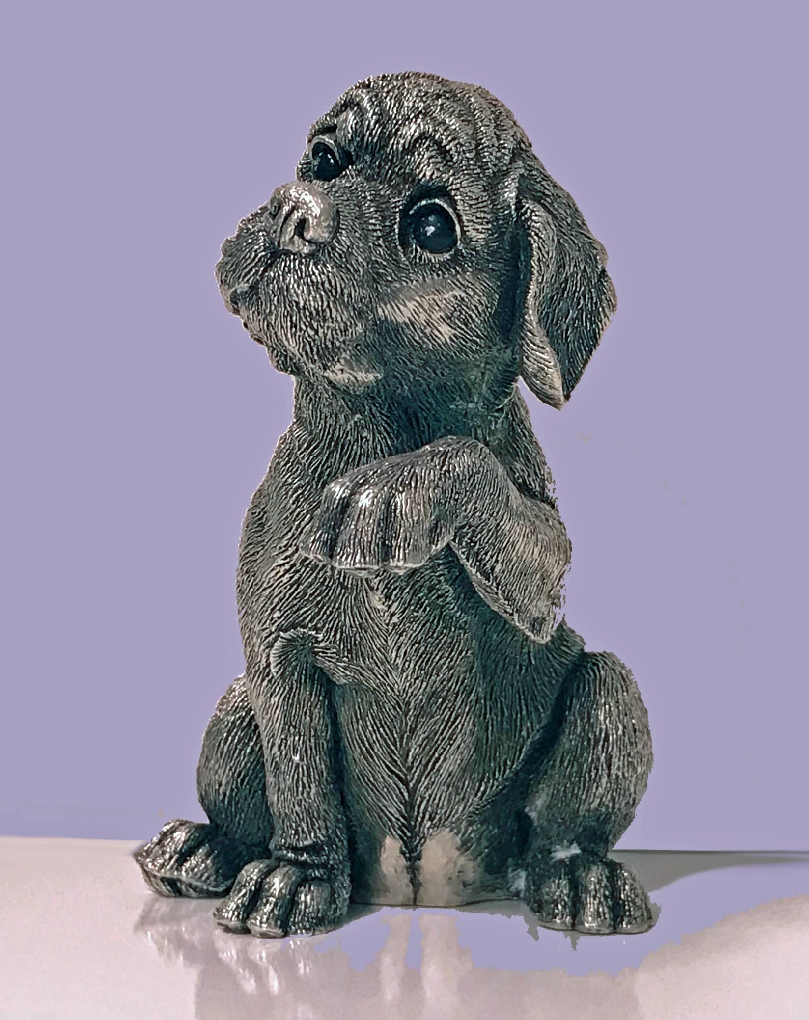 Sterling silver statue sculpture of spaniel dog, circa 1995. Realistically textured, stamped on lower back with various marks including 925 in oval punch, MM and leopards head in hexagonal punch. Measures: 4.5 x 3.5 x 3. inches. Item weight: 390.27